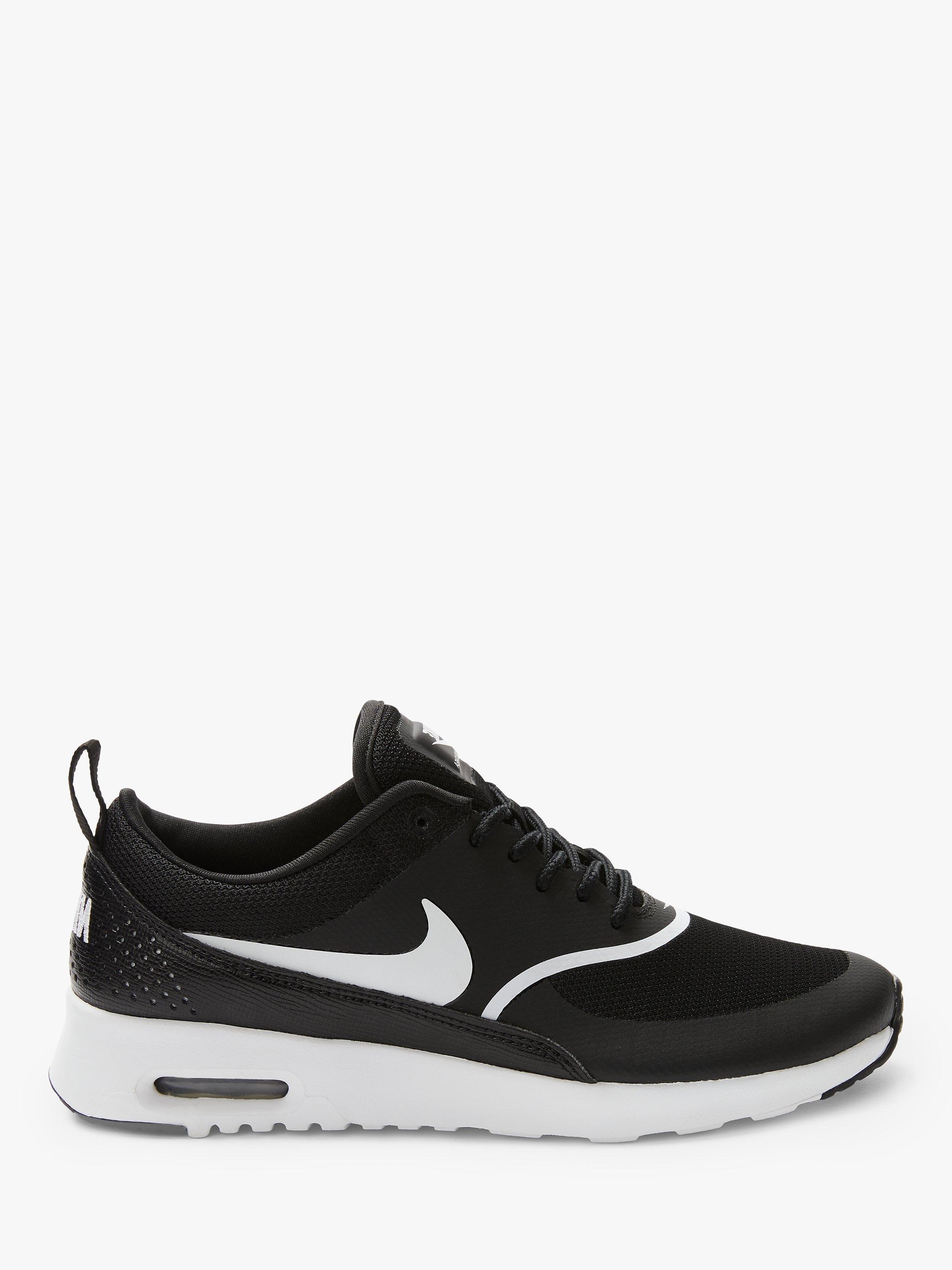 Nike thea black trainers hotsell