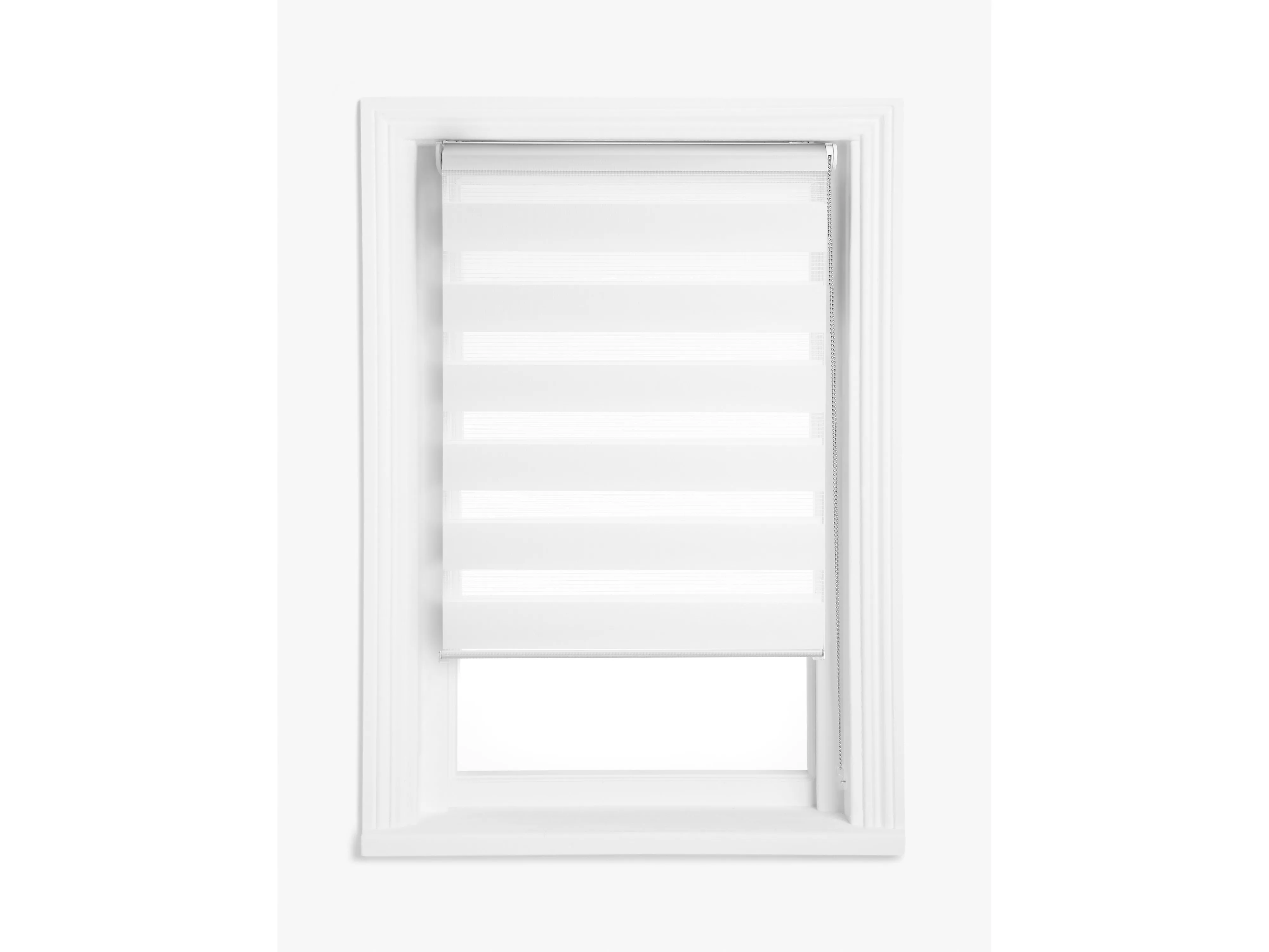 White zebra roller blind on a uPVC window frame, showing alternating sheer and opaque stripes for light control