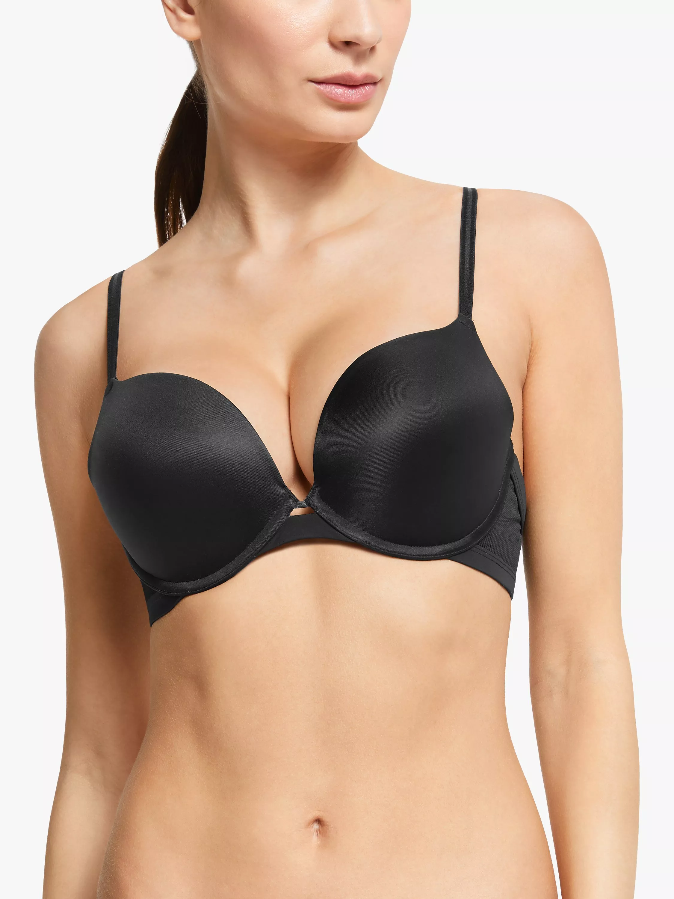 Woman modelling a black padded plunge underwired bra with adjustable straps, front view on a white background