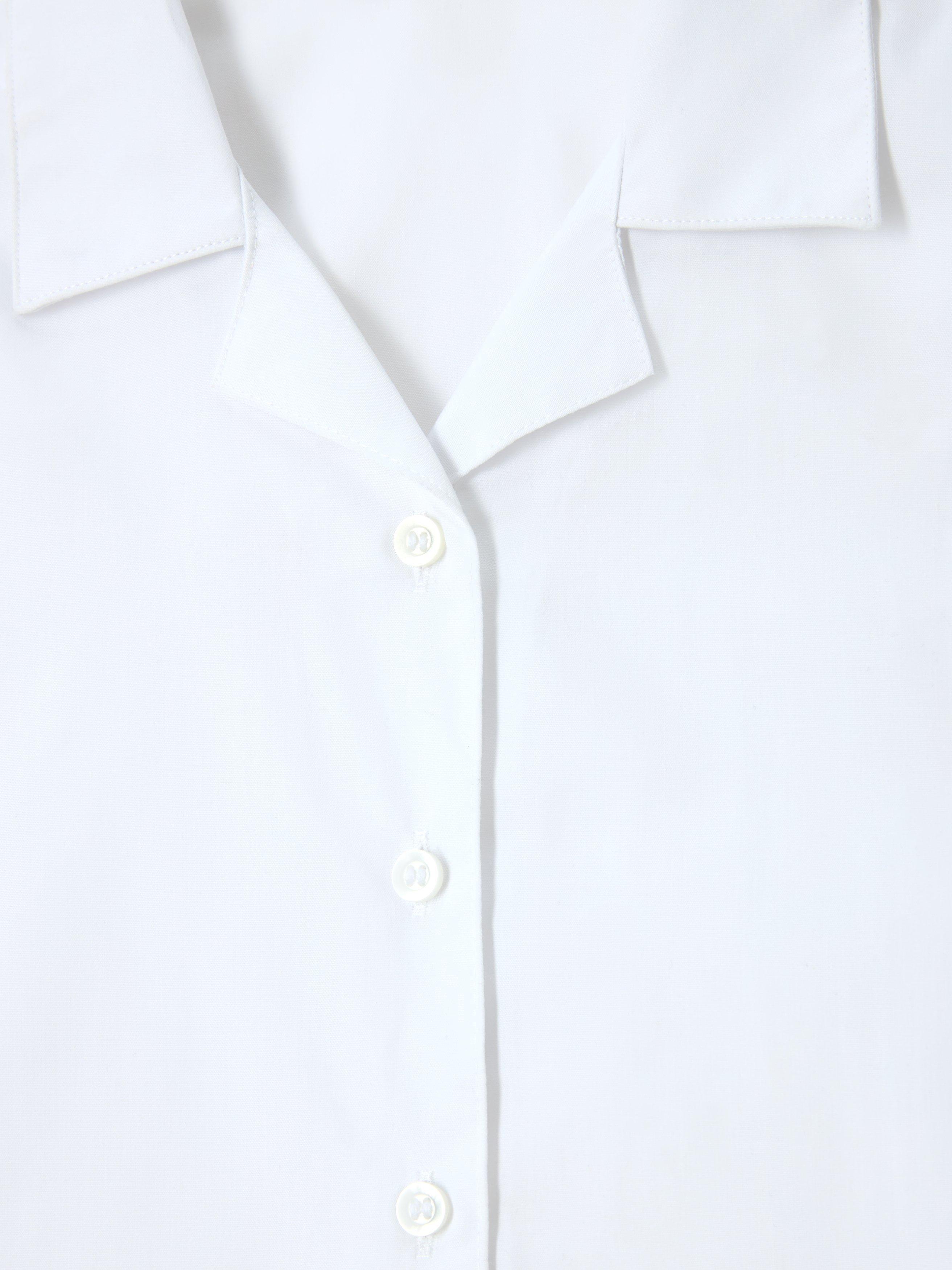 Product image 6 of 6, which shows John Lewis Girls' Open Neck Short Sleeve School Blouse, Pack of 2, White, 4 years