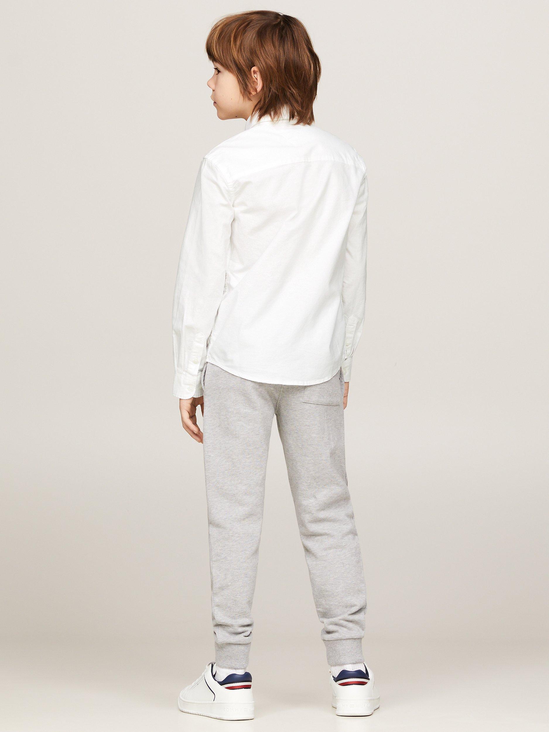 Product image 2 of 7, which shows Tommy Hilfiger Kids' Organic Cotton Blend Stretch Oxford Shirt, White, 3 years