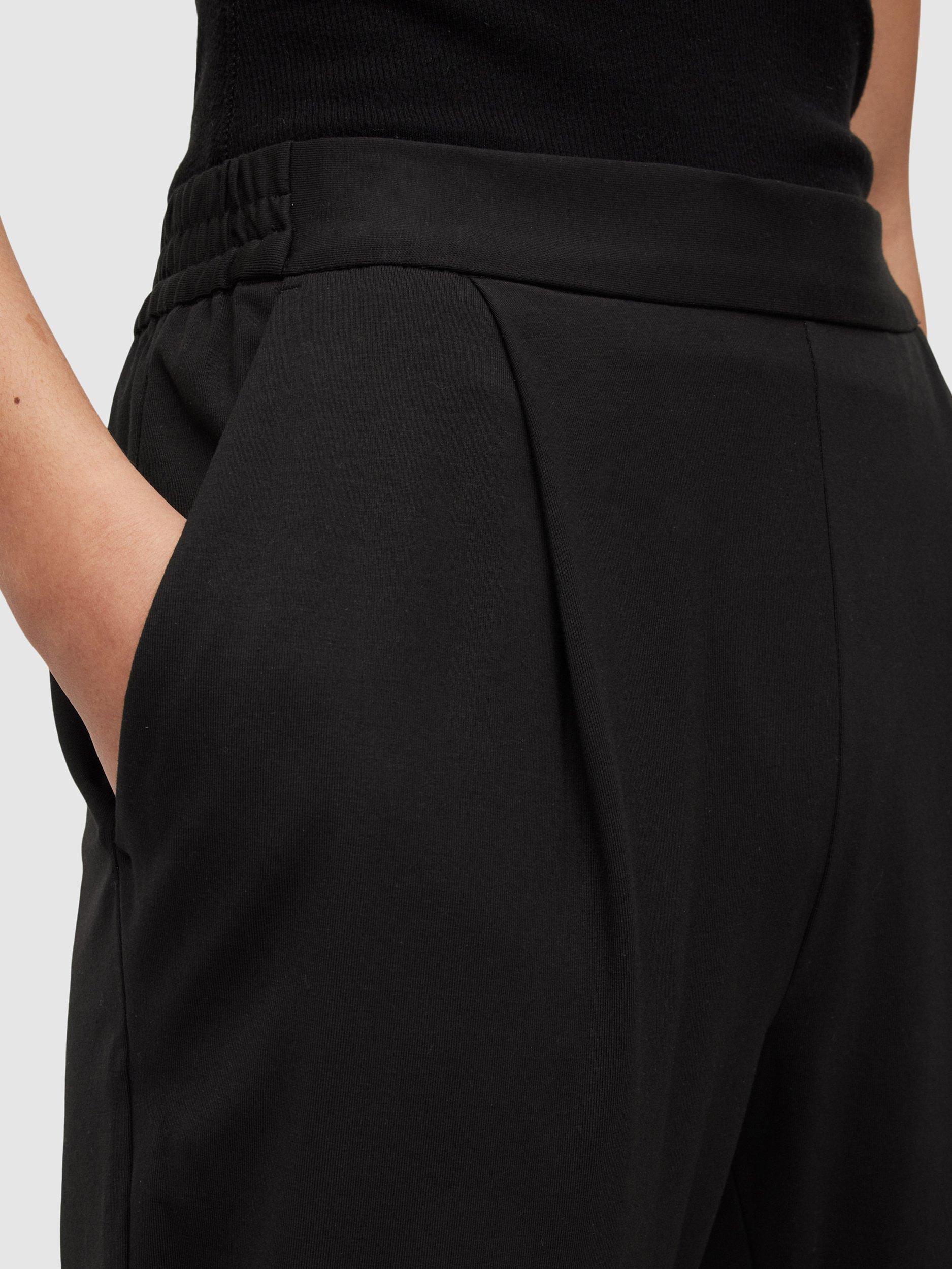 Product image 5 of 8, which shows AllSaints Aleida Ankle Grazer Jersey Trousers, Black, 6