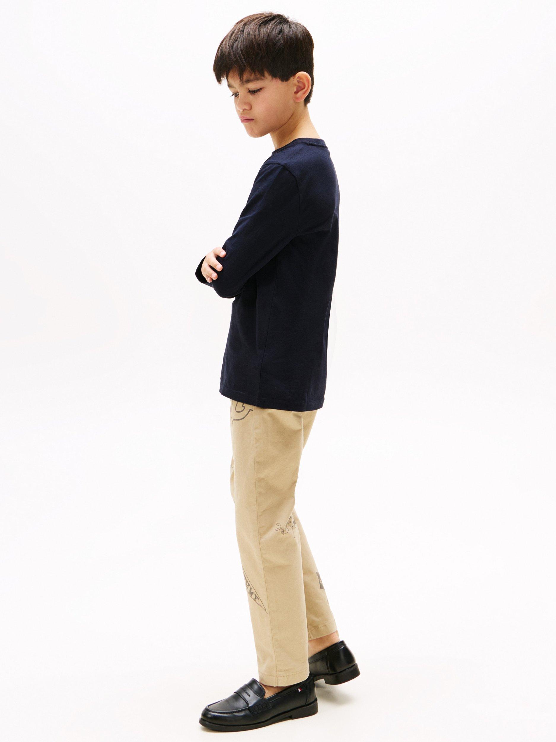 Product image 2 of 3, which shows Tommy Hilfiger Kids' Plain Logo Jersey Top, Pack of 2, Desert Sky/White, 10-12 years