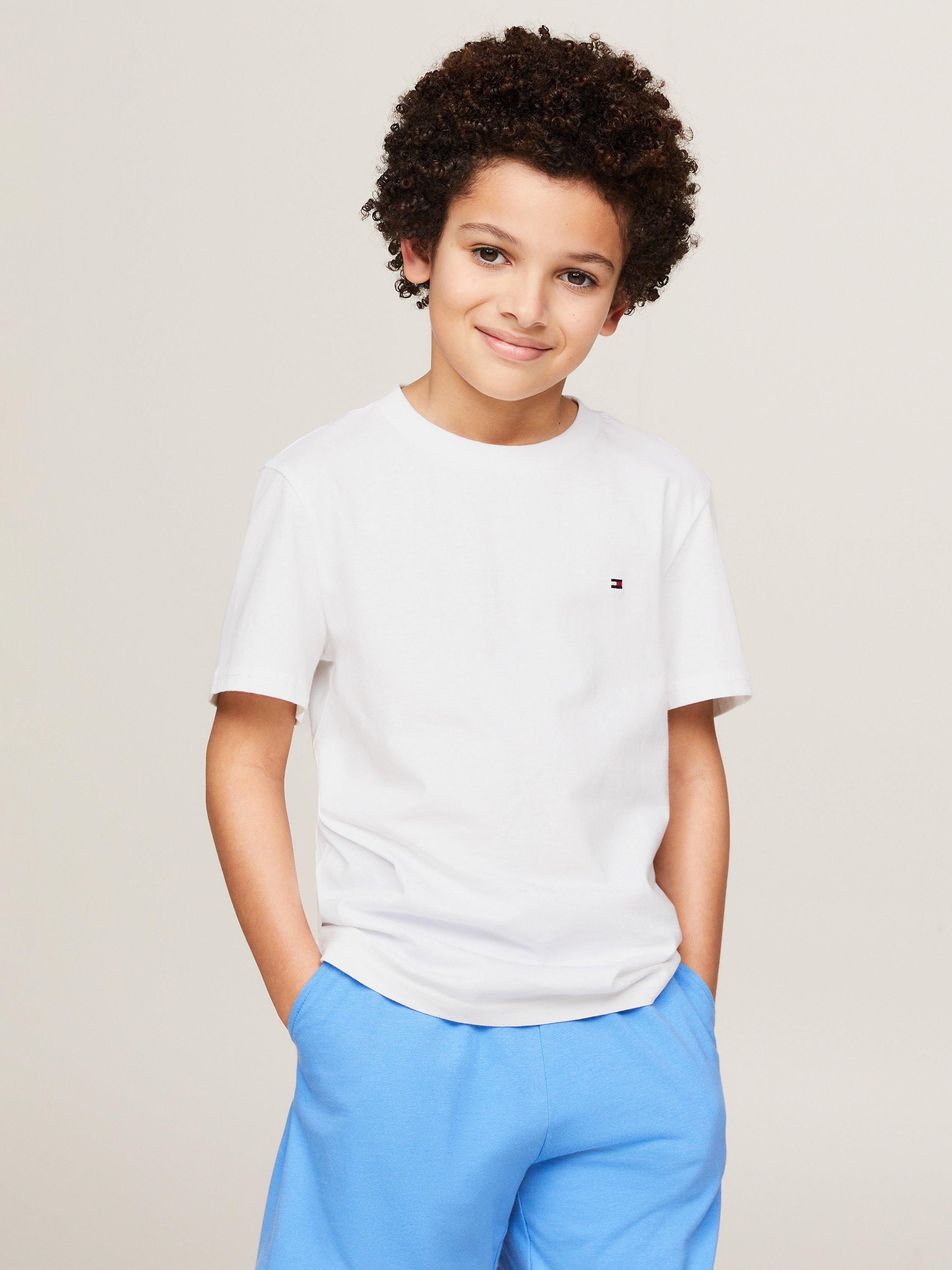 Product image 4 of 5, which shows Tommy Hilfiger Kids' Plain Logo T-Shirts, Pack of 2, Desert Sky/White, 8-10 years