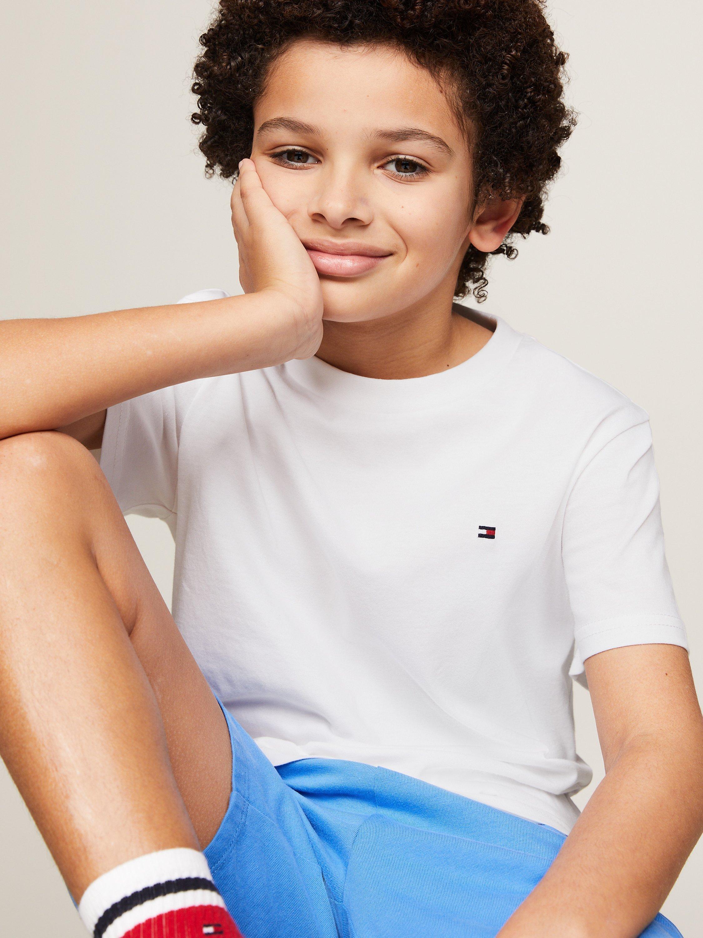 Product image 5 of 5, which shows Tommy Hilfiger Kids' Plain Logo T-Shirts, Pack of 2, Desert Sky/White, 8-10 years
