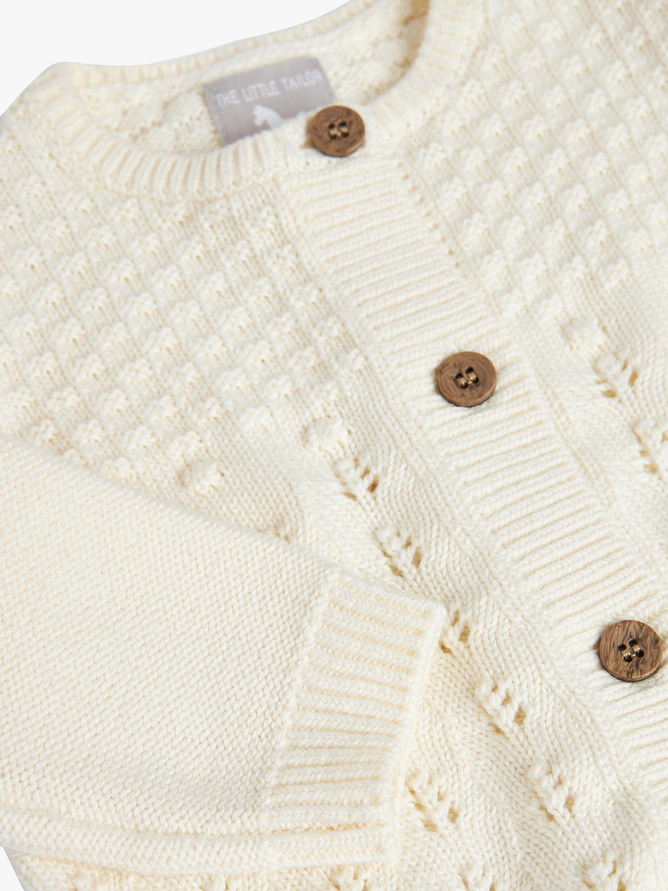 Product image 5 of 9, which shows The Little Tailor Baby Three Piece Cardigan, Bloomer & Bonnet Set, Cream, 6-9 months