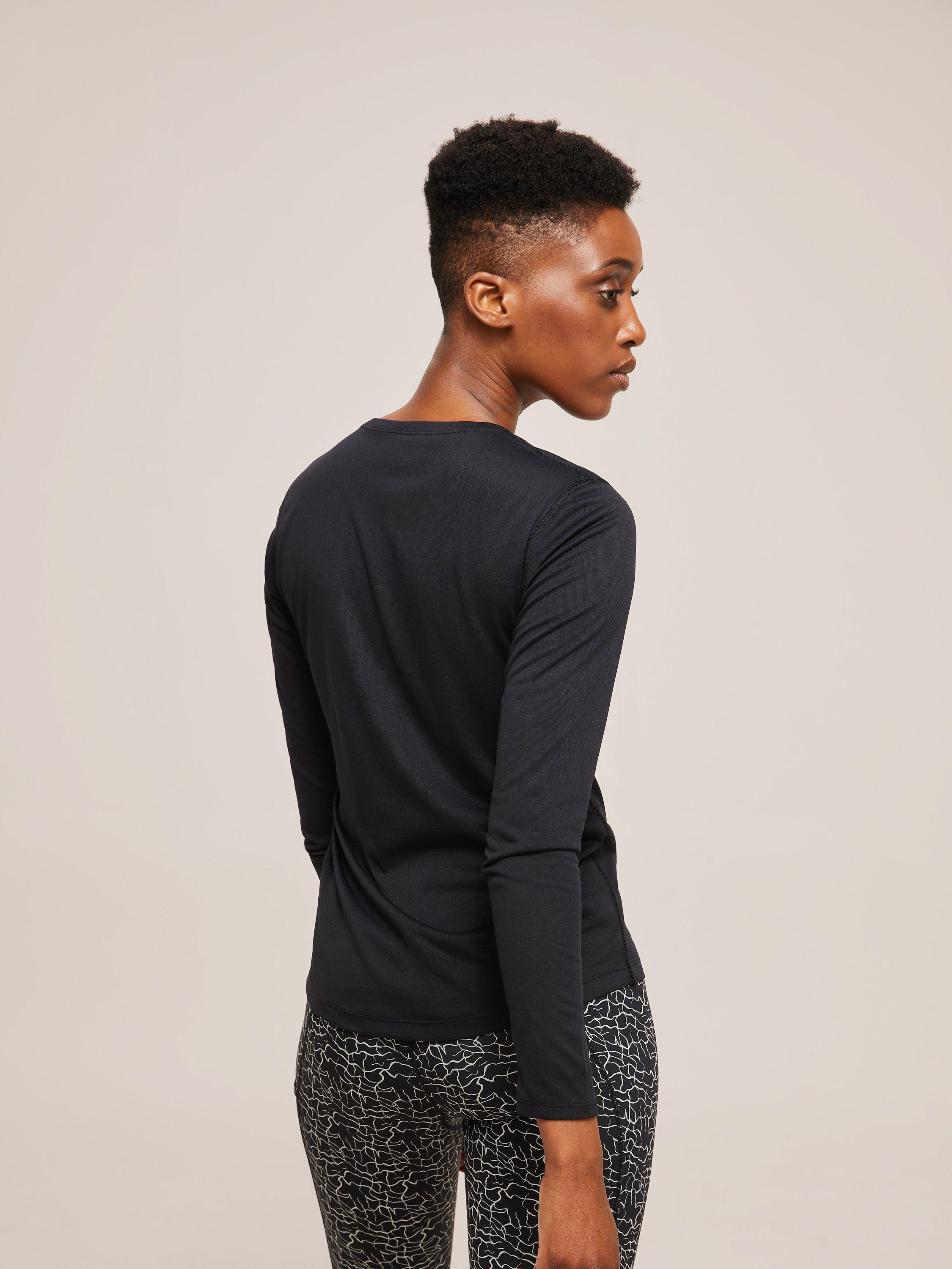 Product image 2 of 5, which shows Ronhill Core Long Sleeve Running Top, Black/Bright White, 8