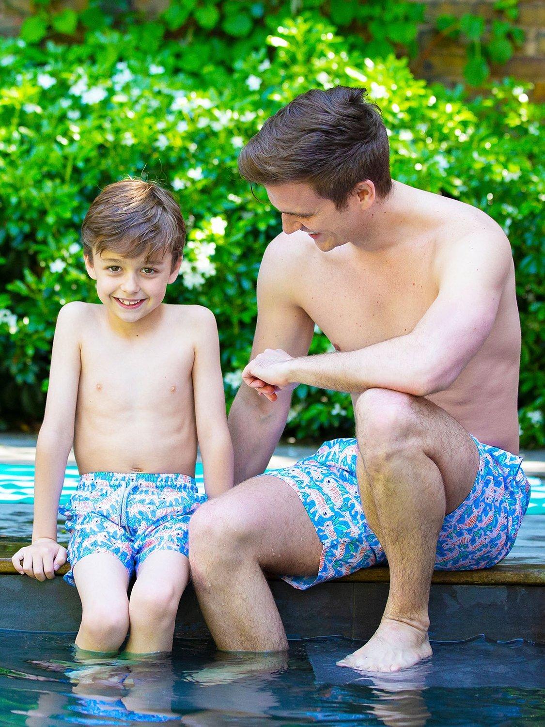 Product image 1 of 4, which shows Trotters Kids' Tiger Swim Shorts, Aqua Blue, 2-3 years