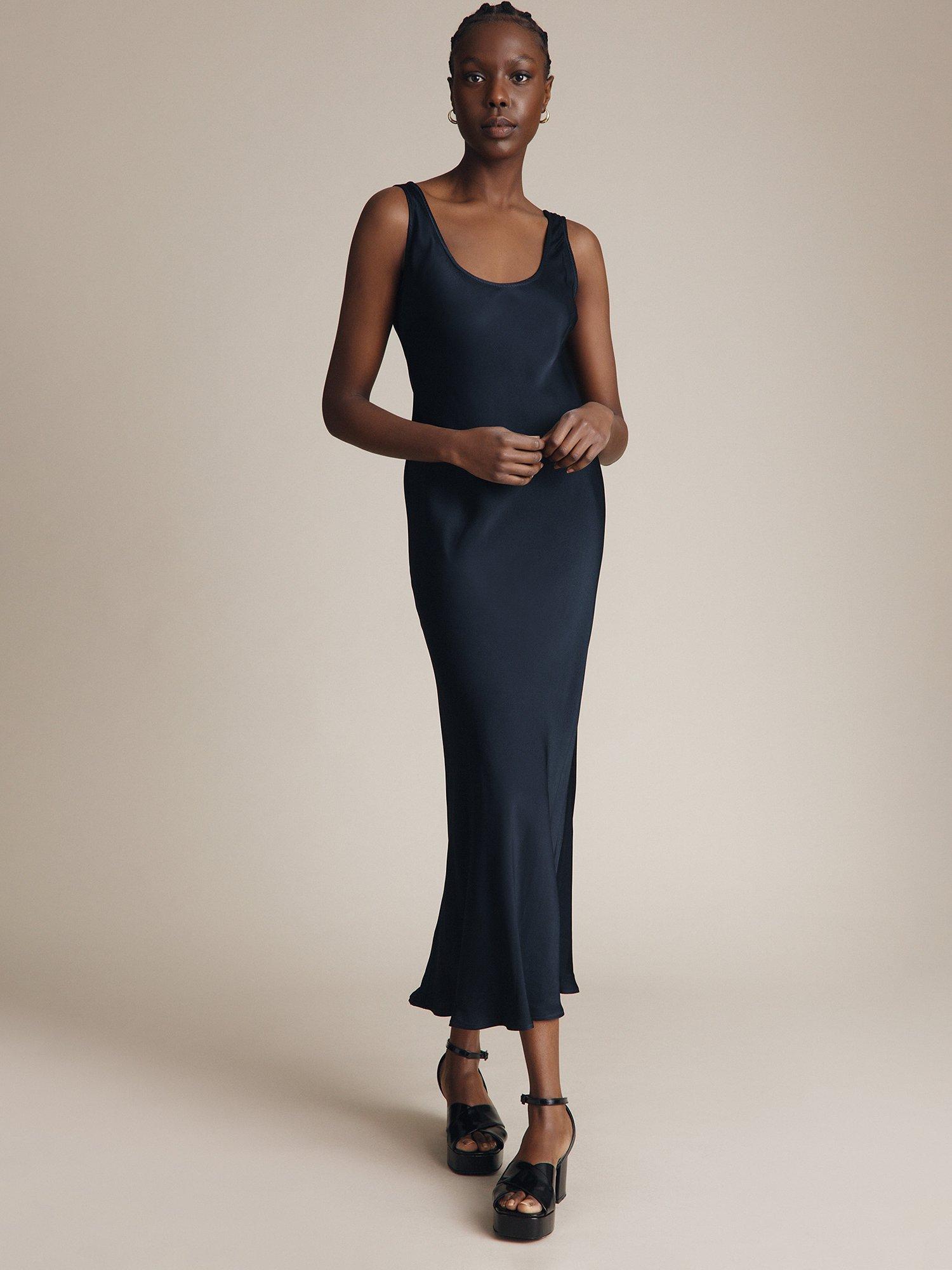 Product image 1 of 4, which shows Ghost Palm Satin Slip Midi Dress, Navy, XXS