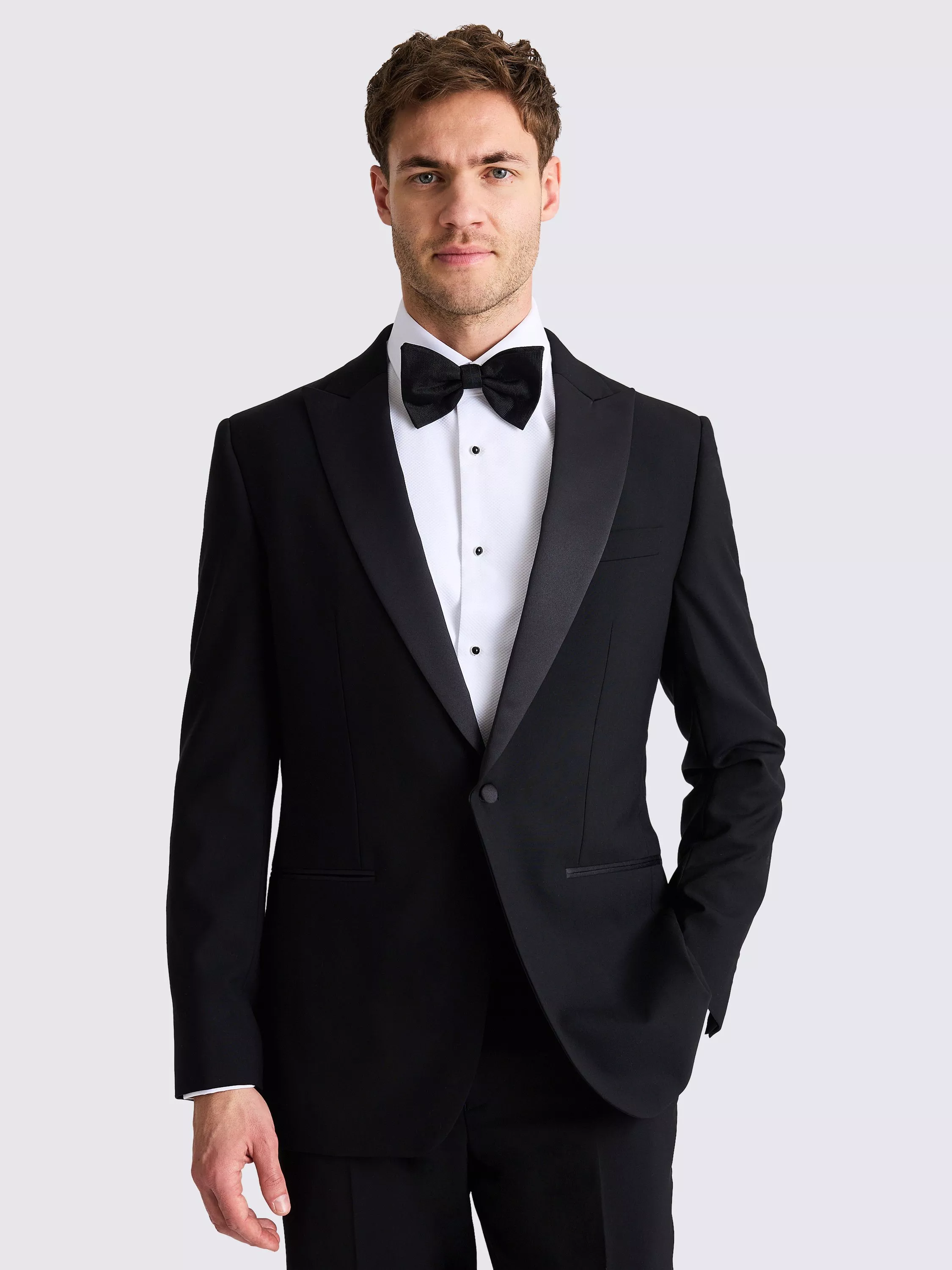 Man wearing double breasted beige tuxedo jacket