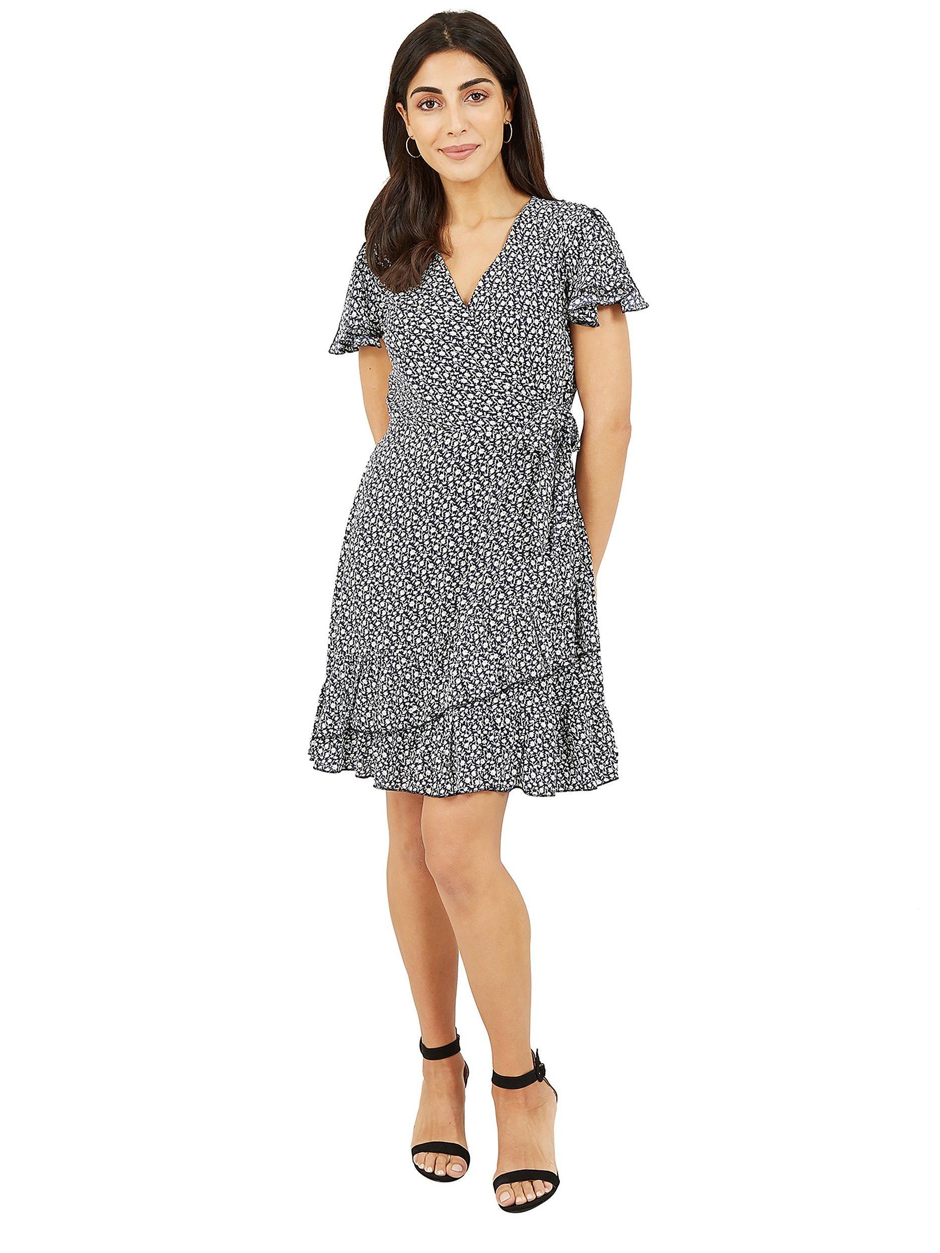 Product image 1 of 5, which shows Yumi Mela London Ditsy Daisy Wrap Effect Frill Mini Dress, Navy, 10