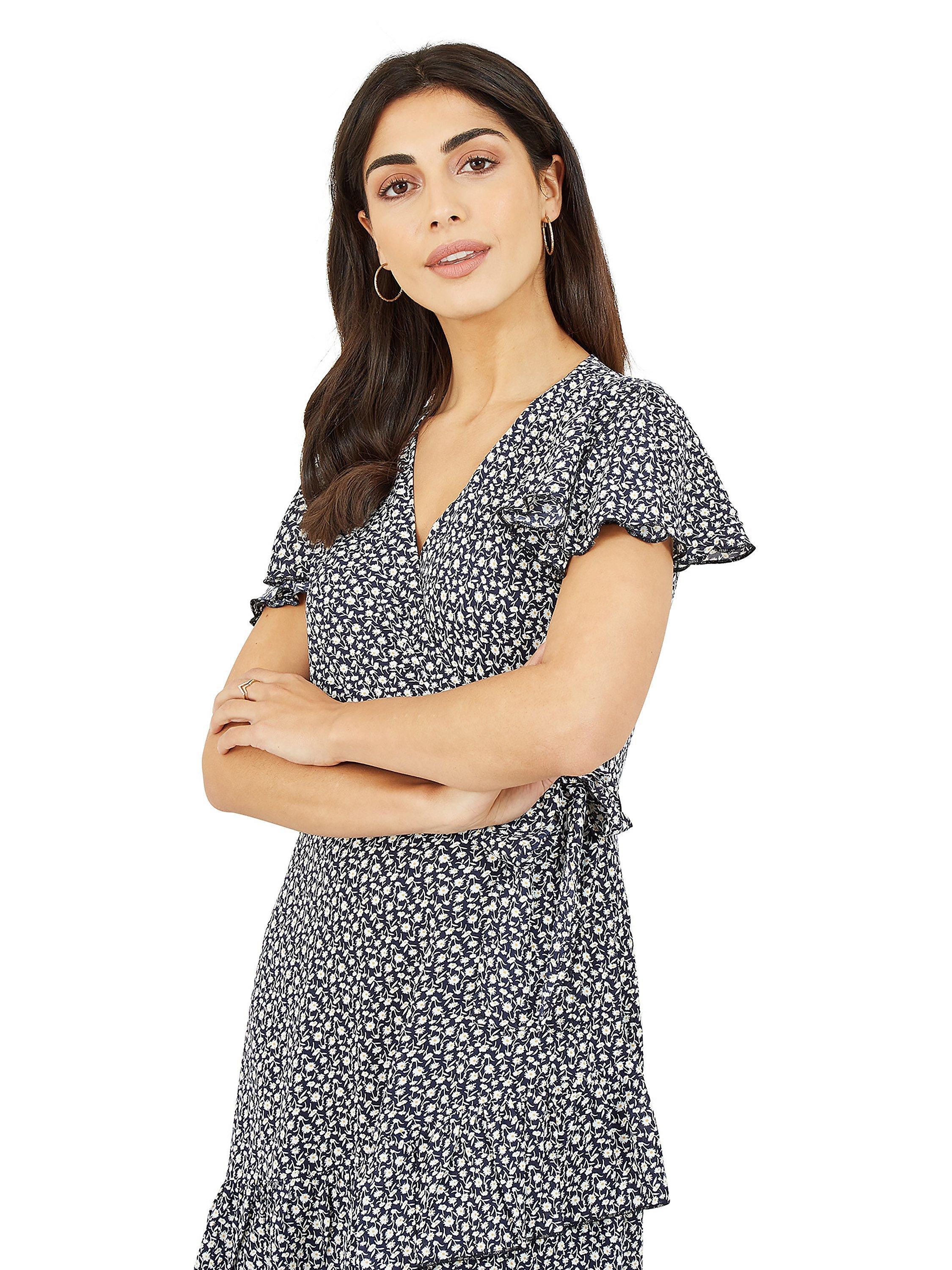 Product image 2 of 5, which shows Yumi Mela London Ditsy Daisy Wrap Effect Frill Mini Dress, Navy, 10