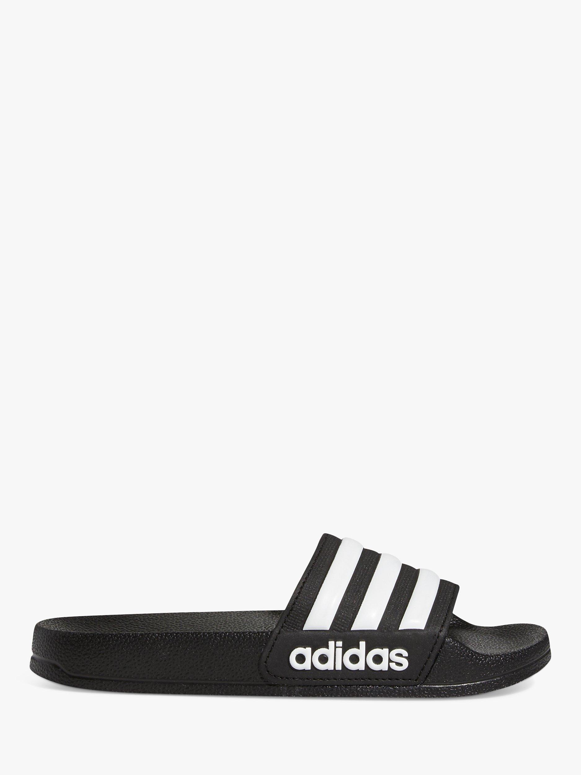 Product image 1 of 10, which shows adidas Kids' Adilette Sliders, Black/White, 5