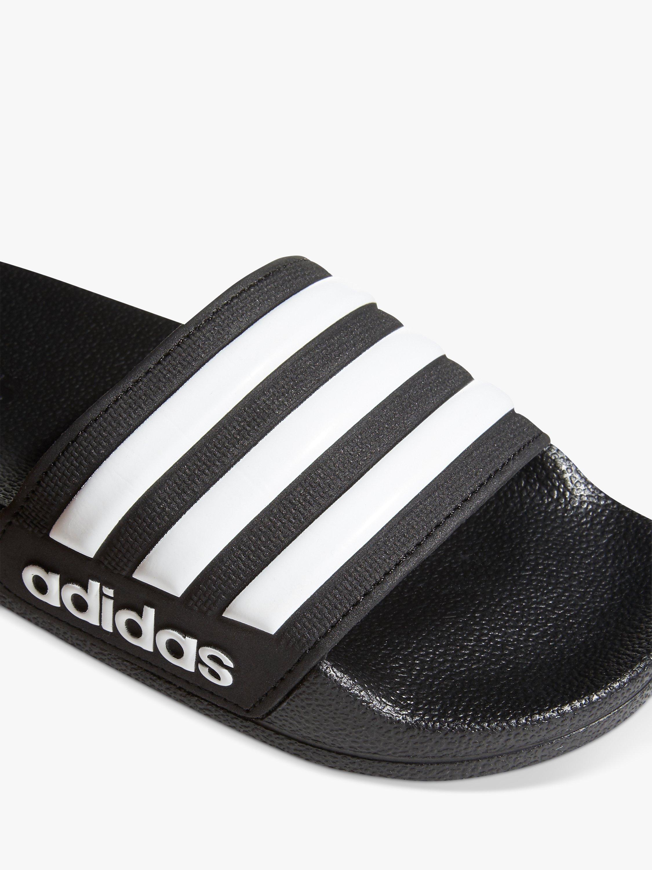 Product image 7 of 10, which shows adidas Kids' Adilette Sliders, Black/White, 5