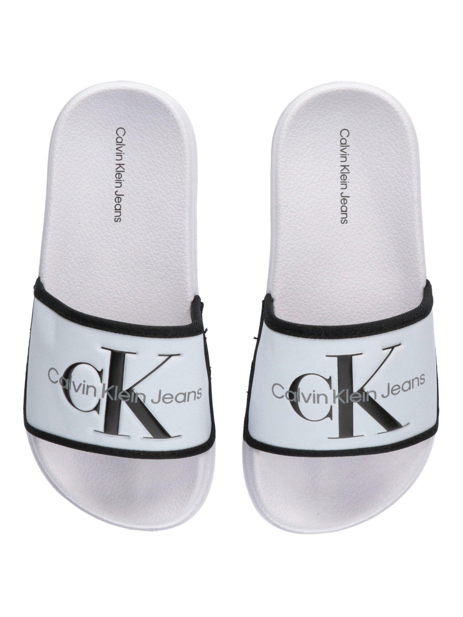 Product image 3 of 4, which shows Calvin Klein Kids' Logo Pool Sliders, White/Black, 29