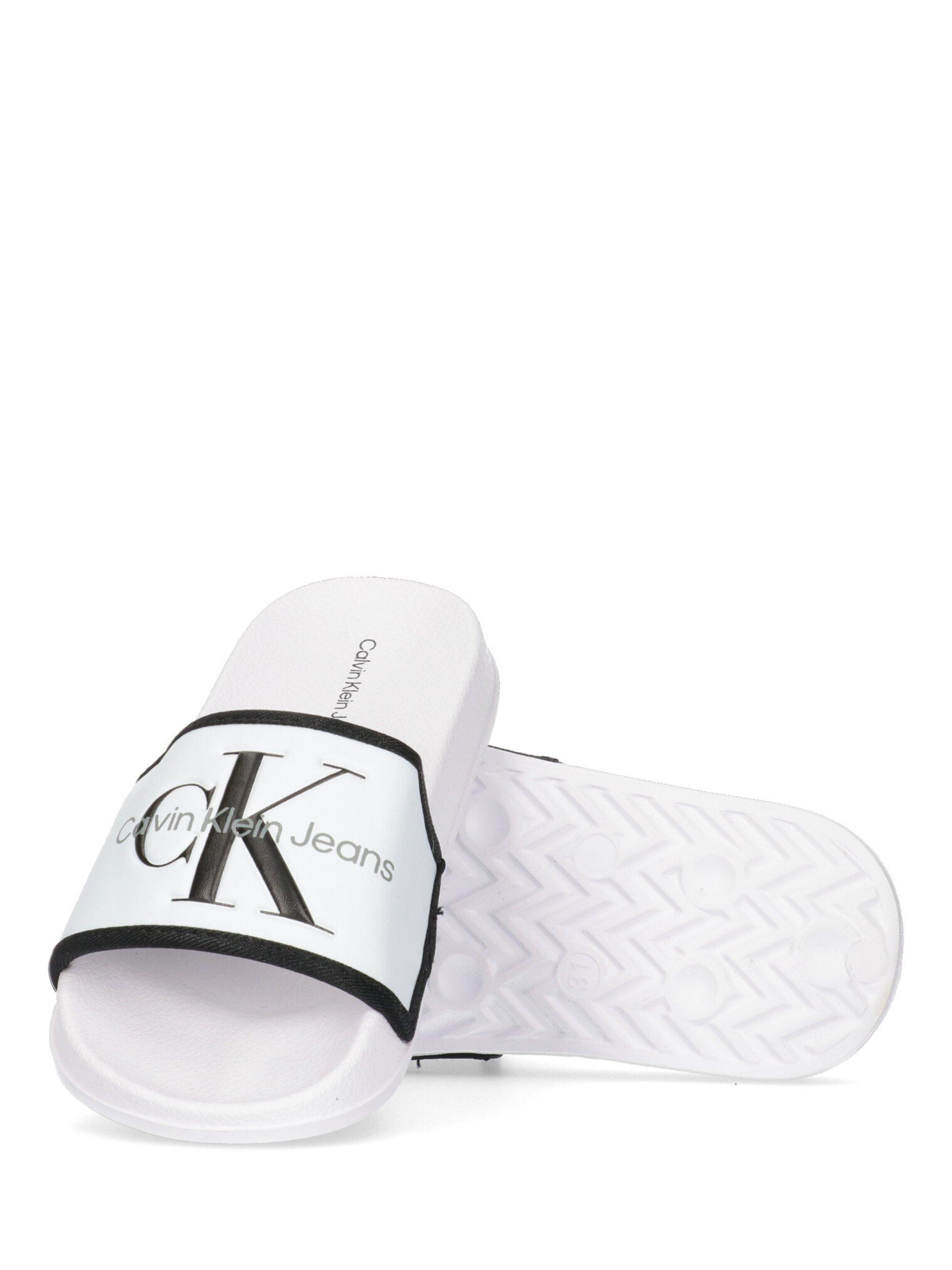 Product image 4 of 4, which shows Calvin Klein Kids' Logo Pool Sliders, White/Black, 29