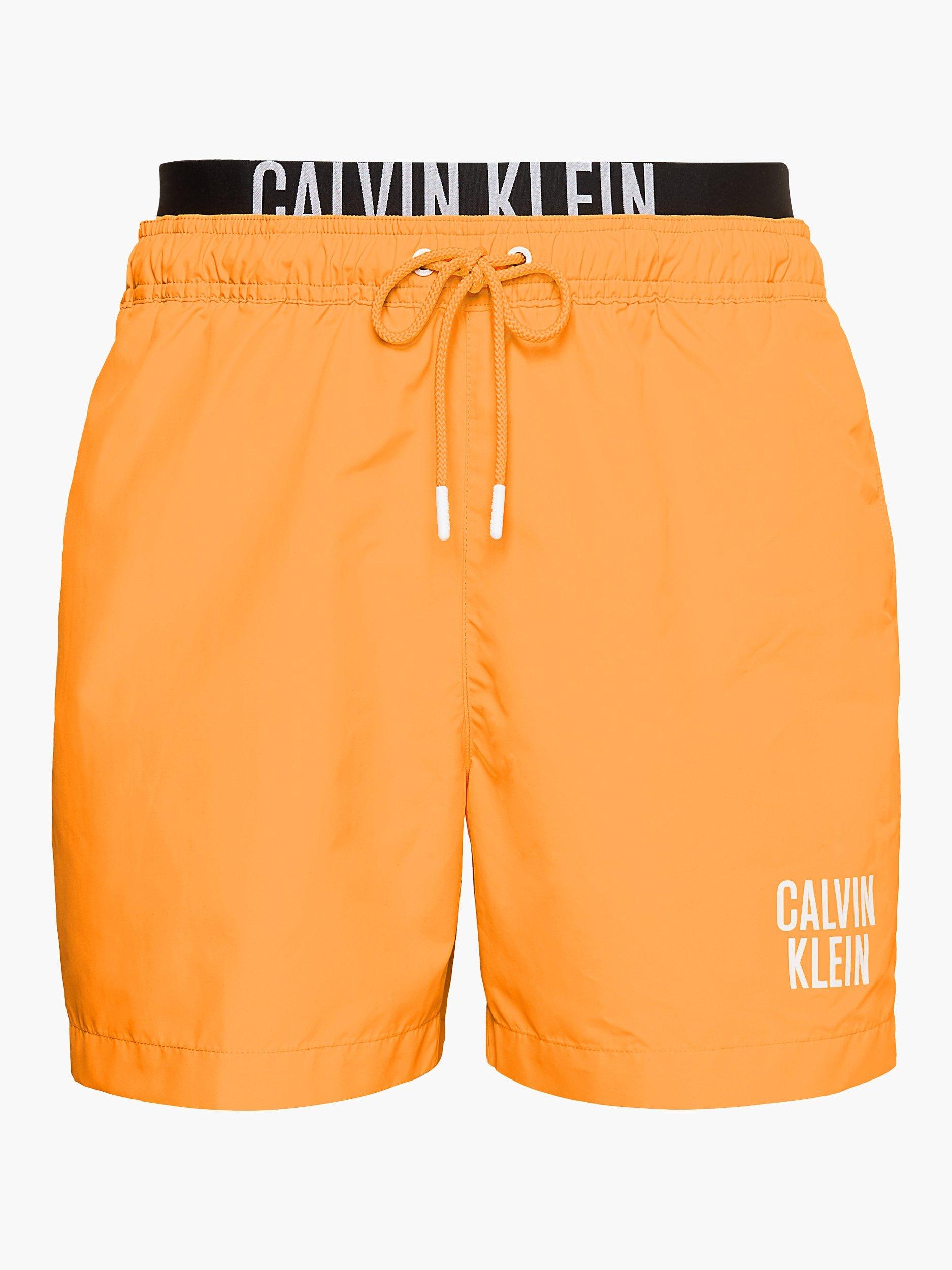 Orange calvin klein swim shorts on sale