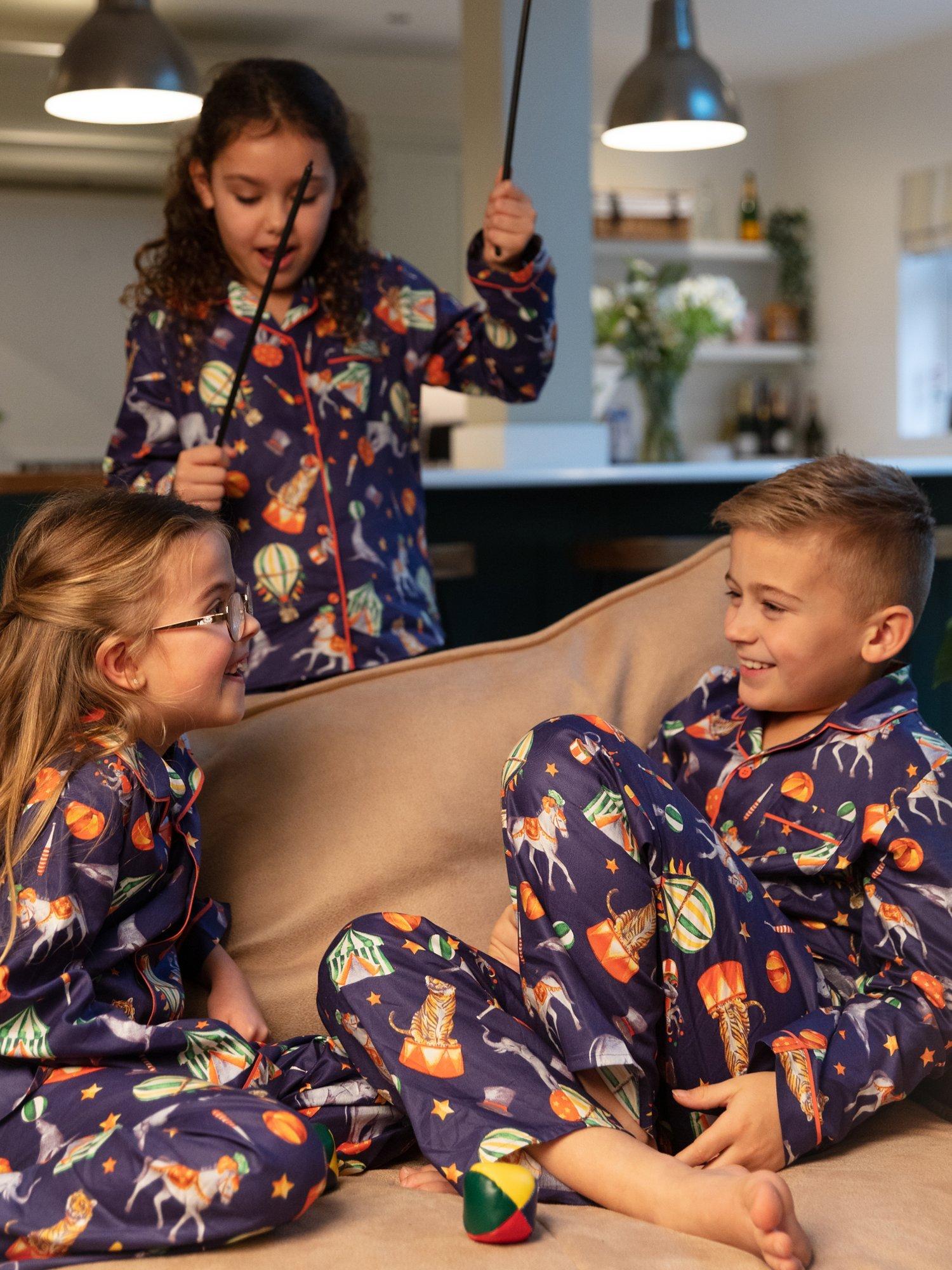 Product image 1 of 4, which shows Minijammies Kids' Charlie Circus Print Unisex Pyjamas, Blue, 8-9 years