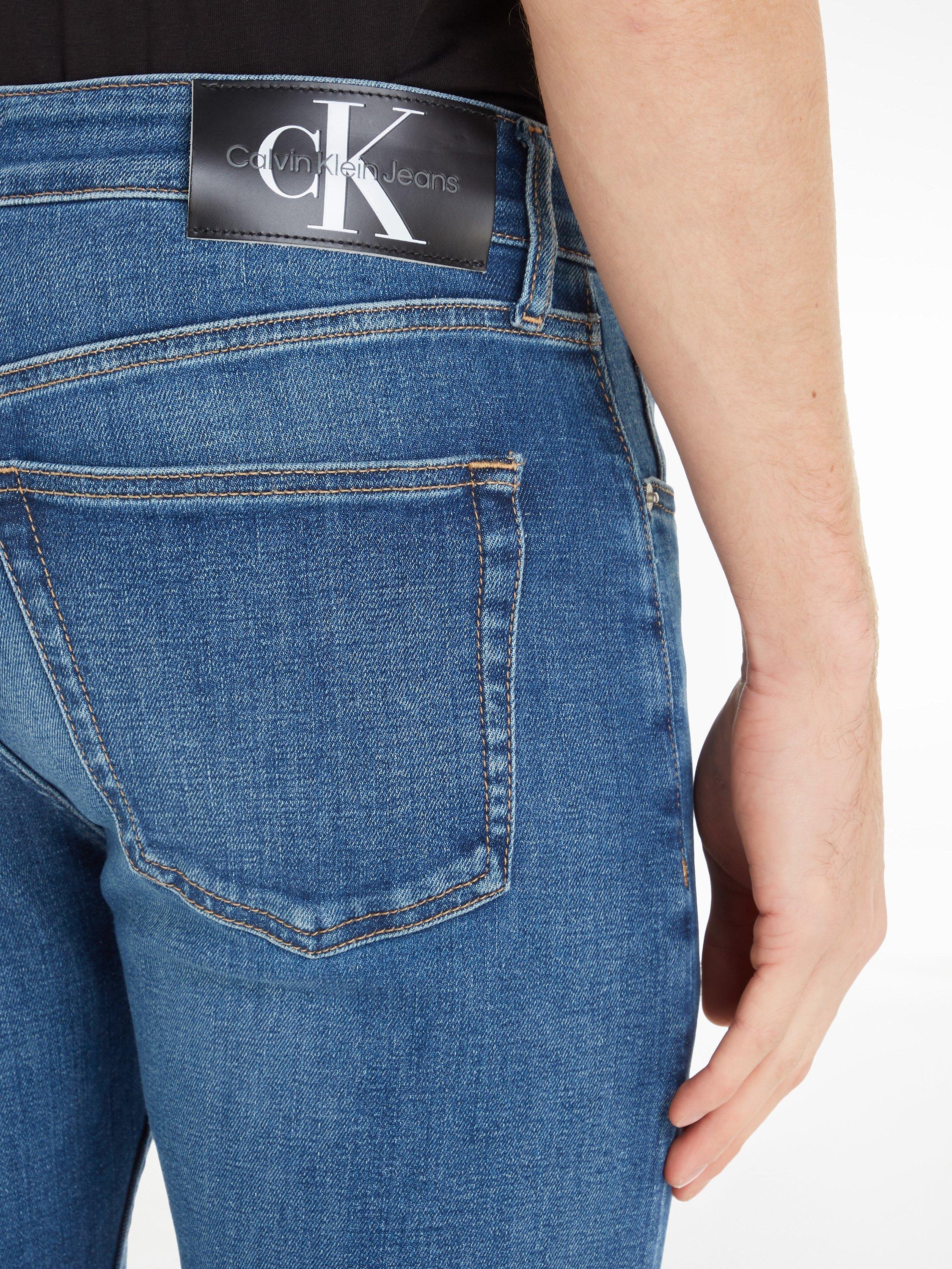 Product image 3 of 6, which shows Calvin Klein Slim Tapered Jeans, Denim Dark, 32S