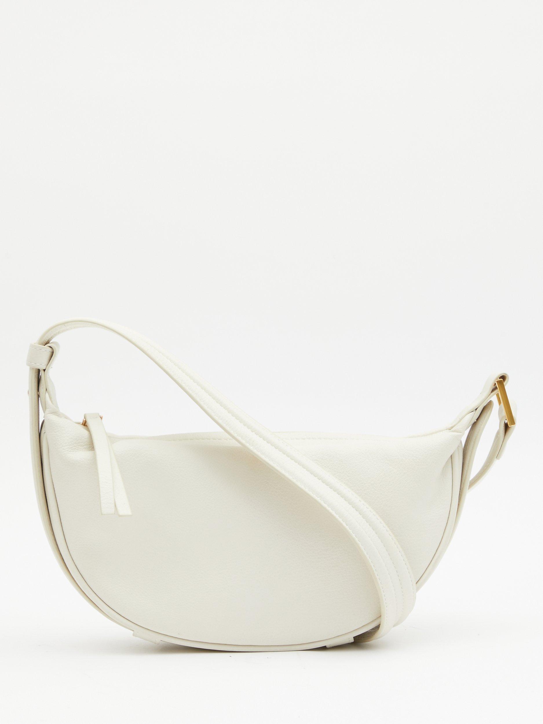 Product image 1 of 6, which shows HUSH Rory Crescent Leather Crossbody Bag, Bone, One Size