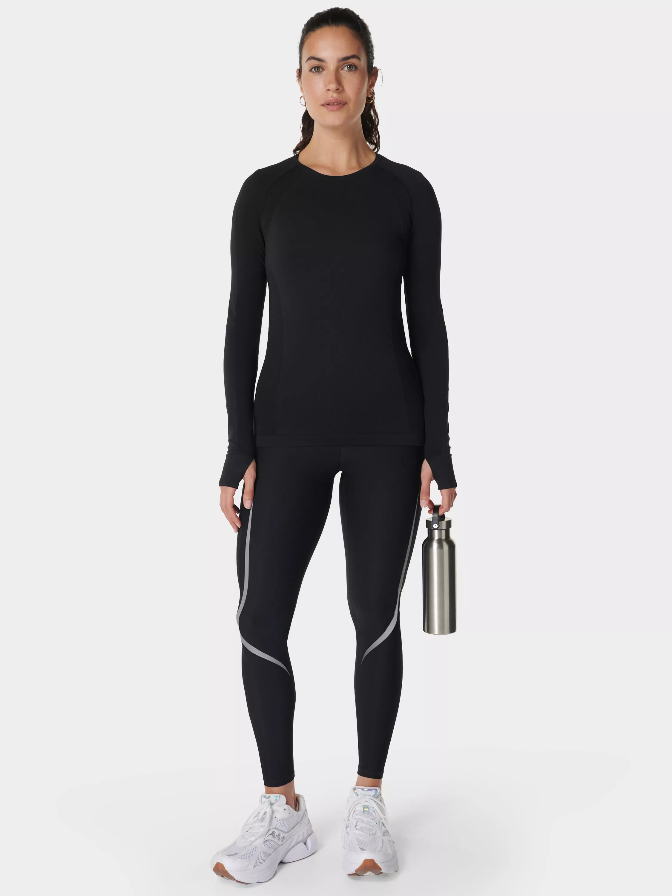 woman wearing running leggings and long sleeve top