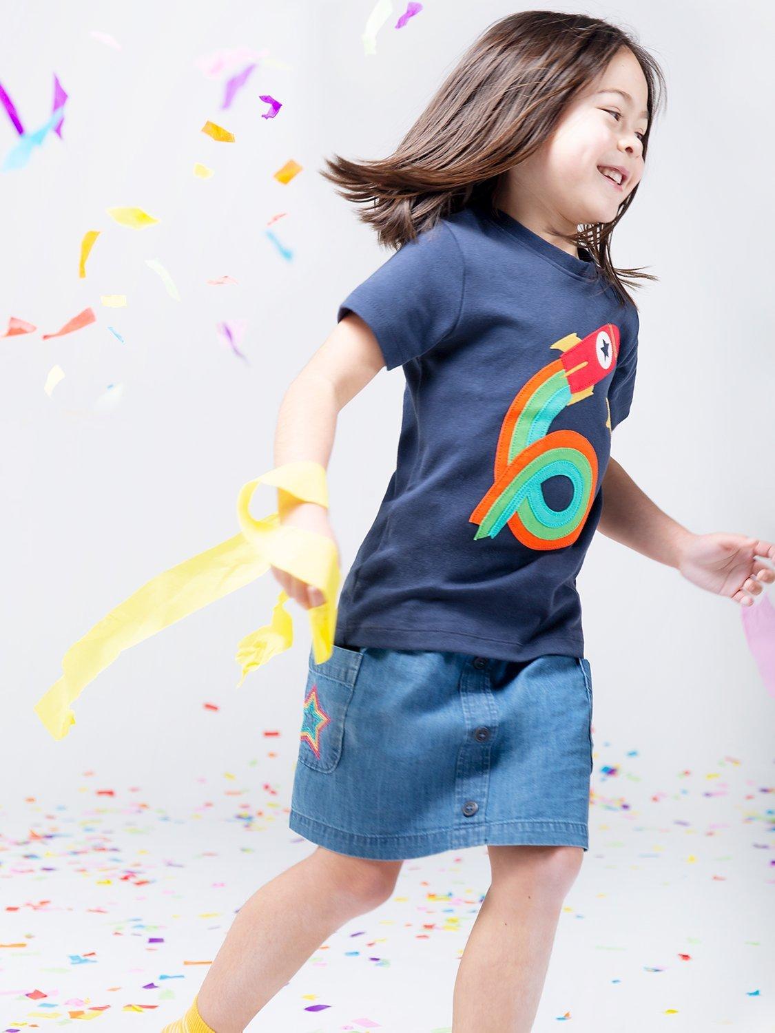 Product image 1 of 3, which shows Frugi Kids' Magic Number 6 Organic Cotton Rocket T-shirt, Indigo/Multi, 6-7 years