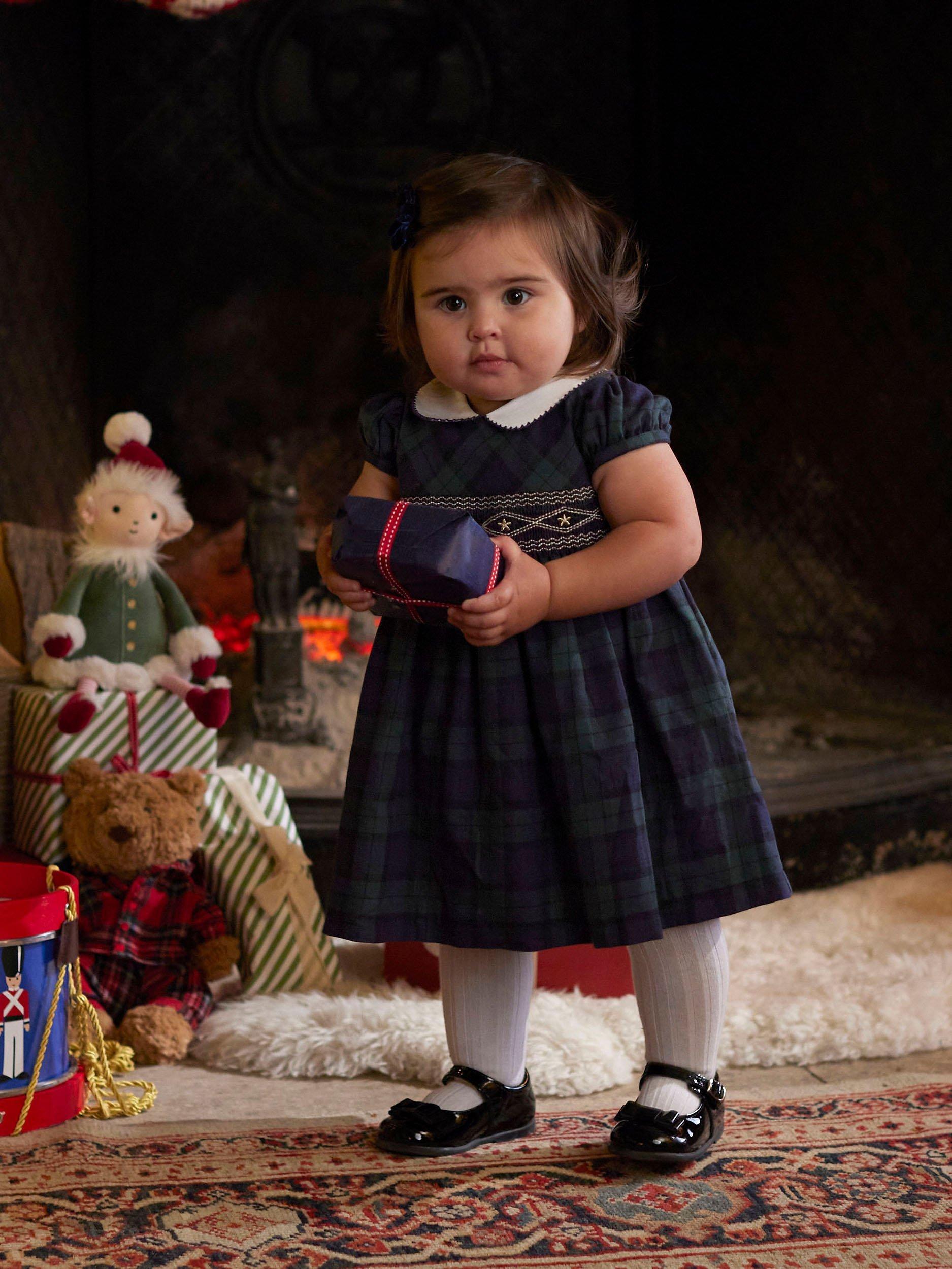 Product image 4 of 6, which shows Trotters Charlotte Baby Tartan Smocked Dress, Navy/Multi, 3-6 months