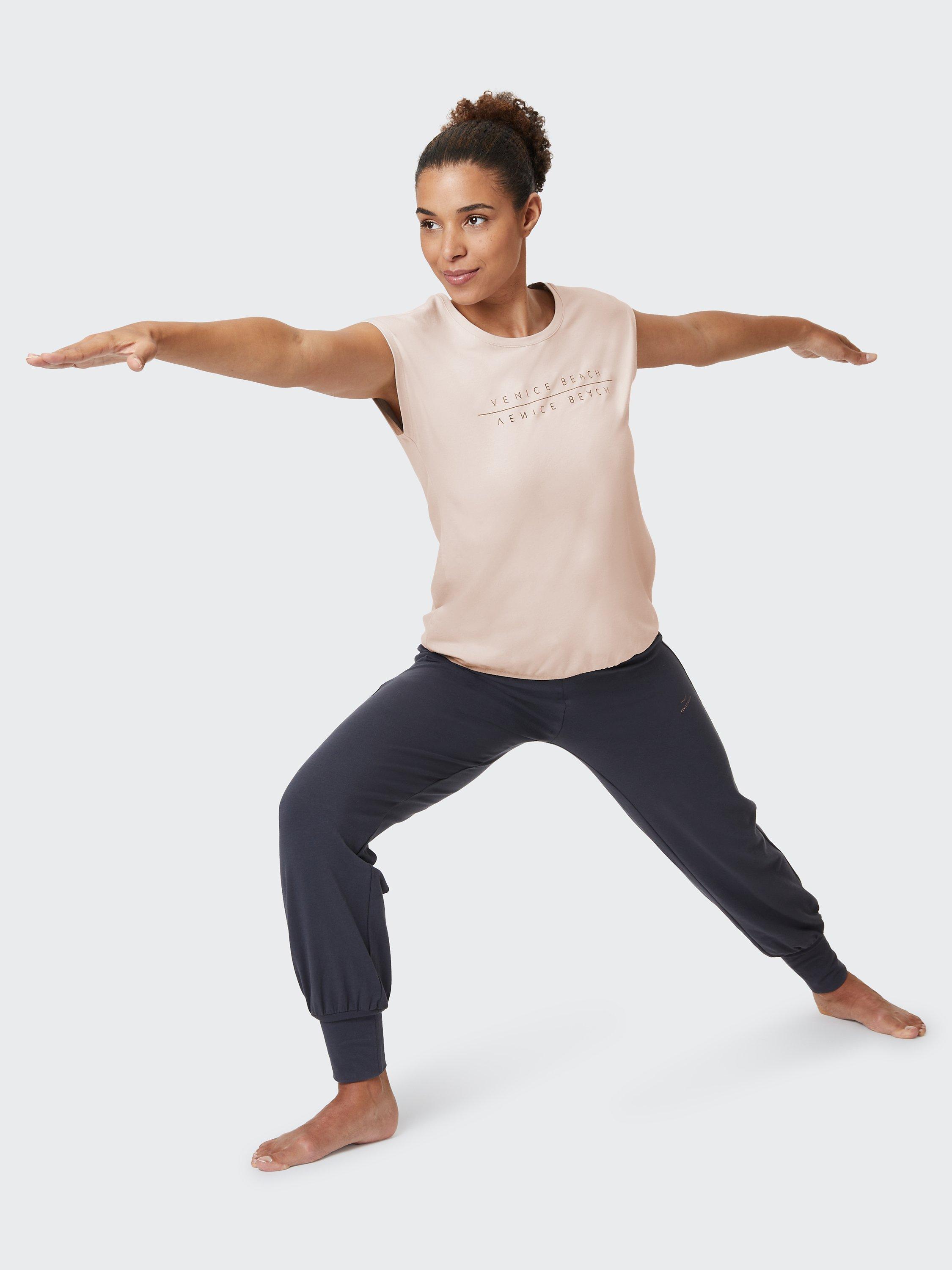 Product image 1 of 7, which shows Venice Beach Wonder Short Sleeve Gym Top, Almond Cream, S