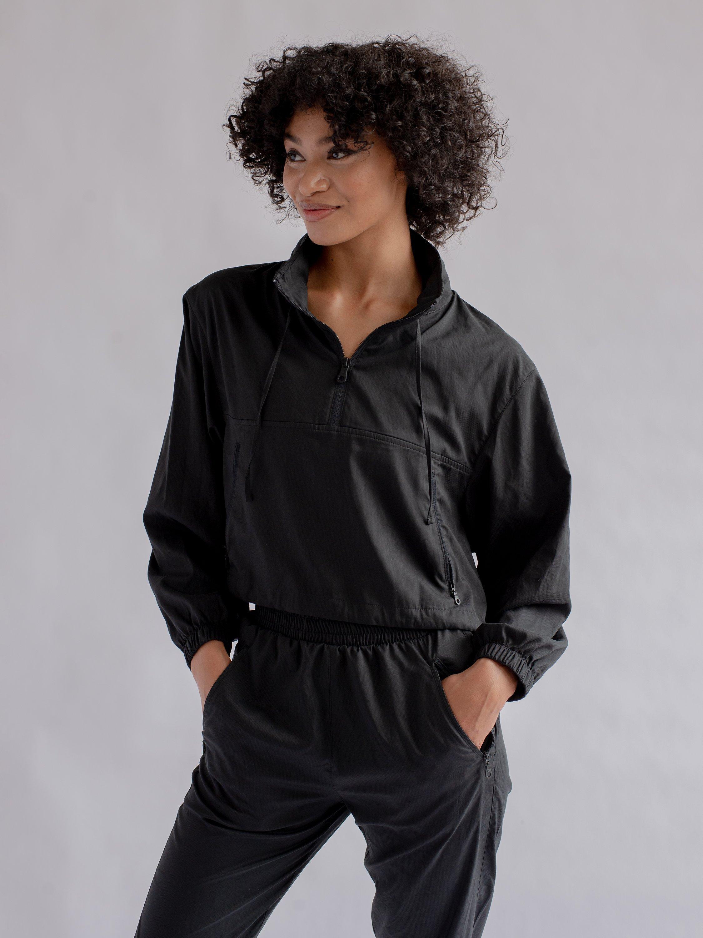 Product image 2 of 6, which shows Girlfriend Collective Hummingbird Half Zip Windbreaker, Black, XS