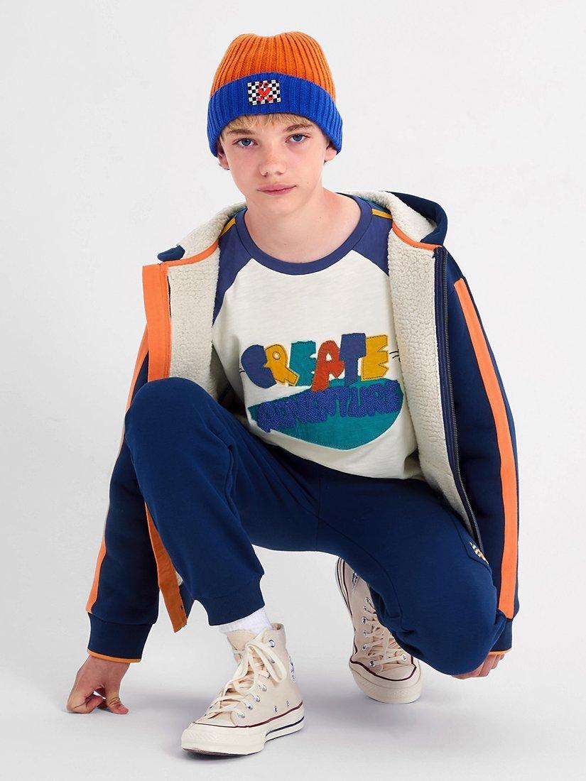 Product image 1 of 4, which shows Monsoon Kids' Stripe Adventure T-Shirt, Ivory/Multi, 9-10 years
