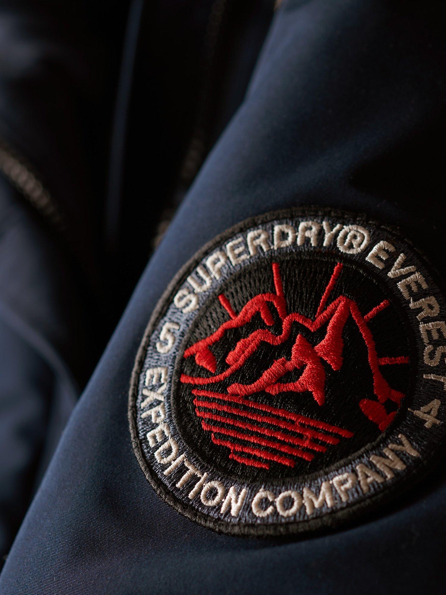 Product image 3 of 7, which shows Superdry Everest Faux Hooded Parka Coat, Navy, 16