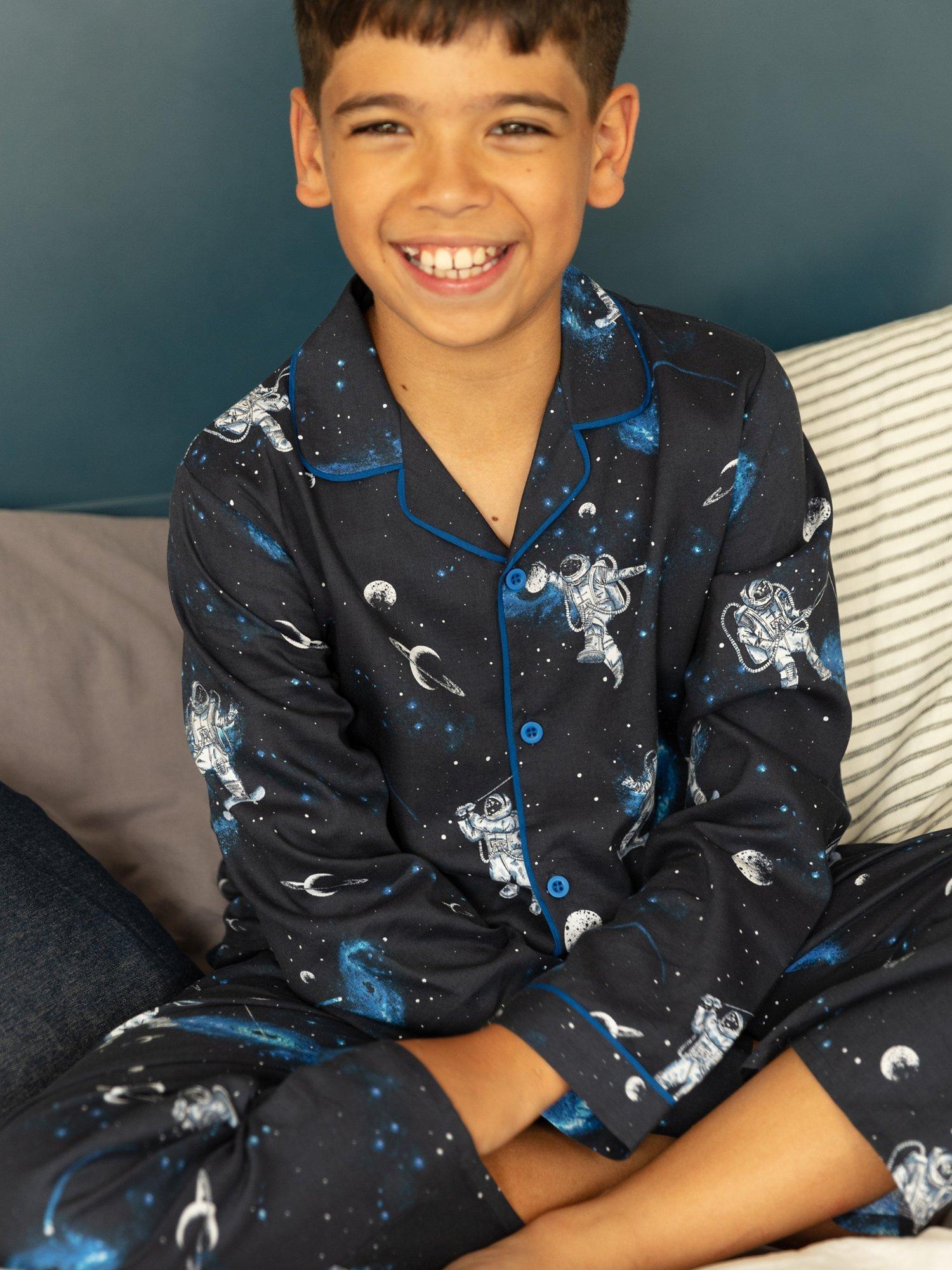 Product image 1 of 4, which shows Minijammies Kids' Aldrin Astronaut Long Sleeve Pyjama Set, Navy/Multi, 10-11 years