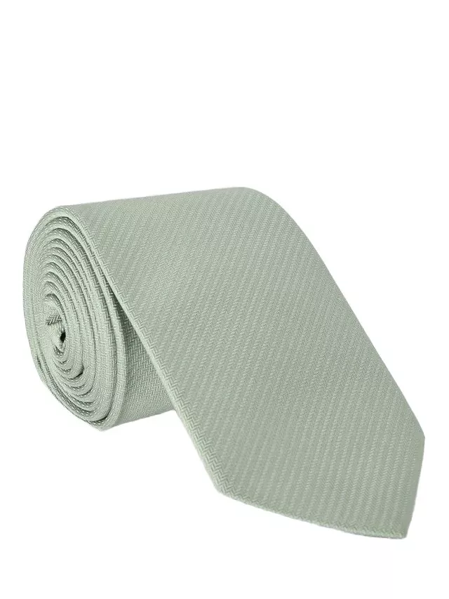 Green tie, rolled up