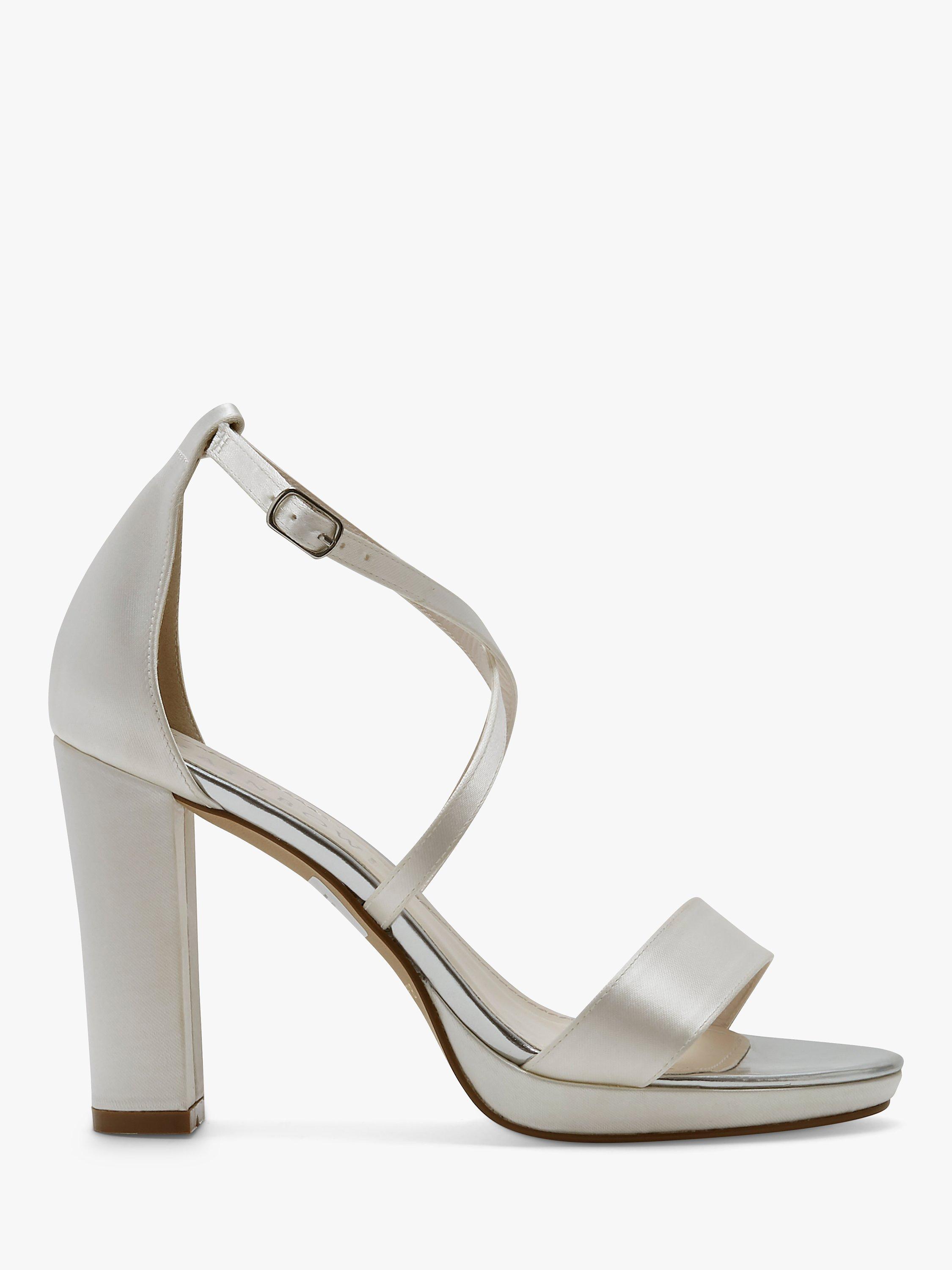 Product image 1 of 4, which shows Rainbow Club Block Heel Wedding Sandals, Ivory Satin, 4.5