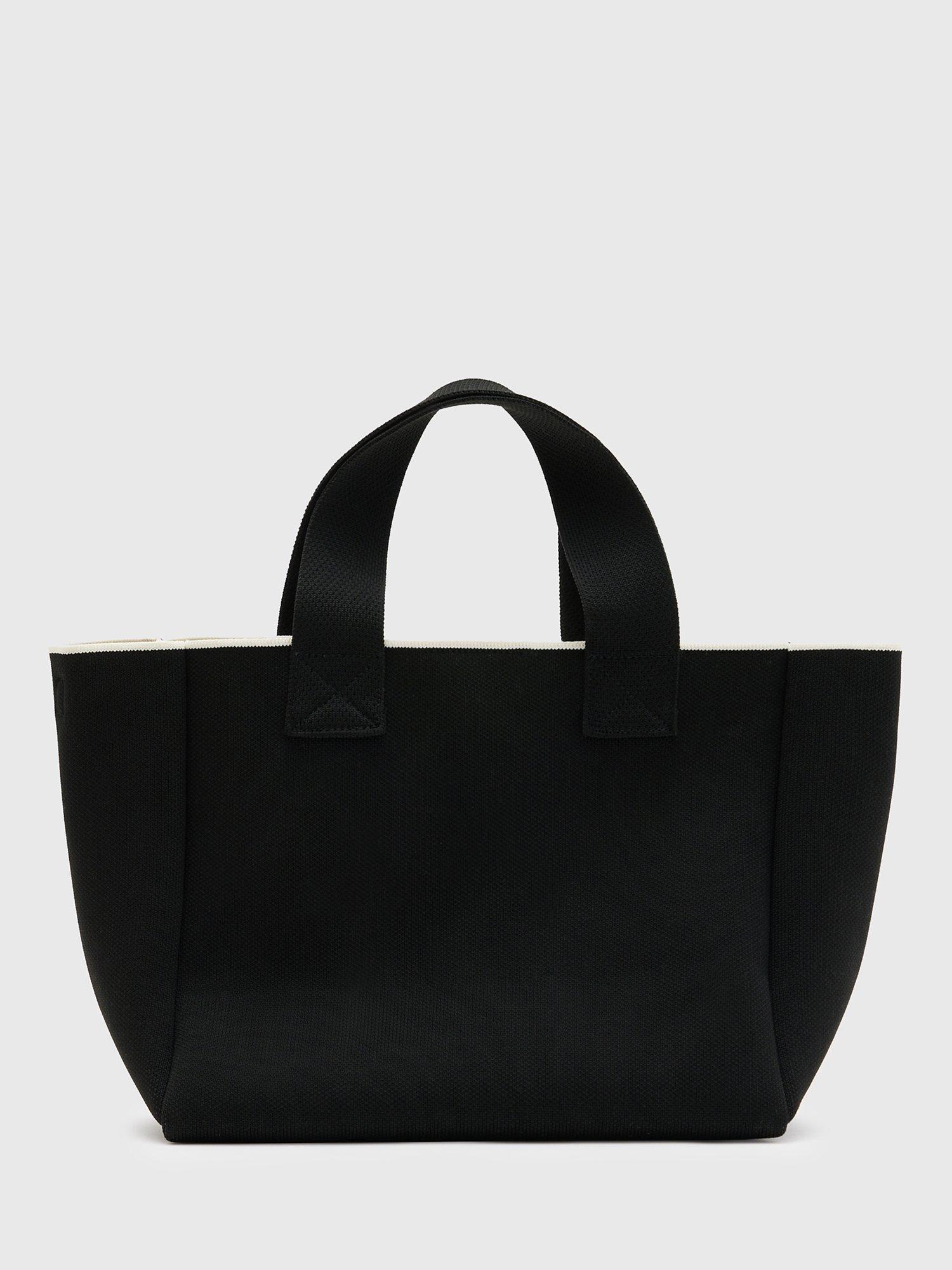 Product image 2 of 6, which shows AllSaints Izzy Knitted Recycled Mini Tote Bag, Black, One Size