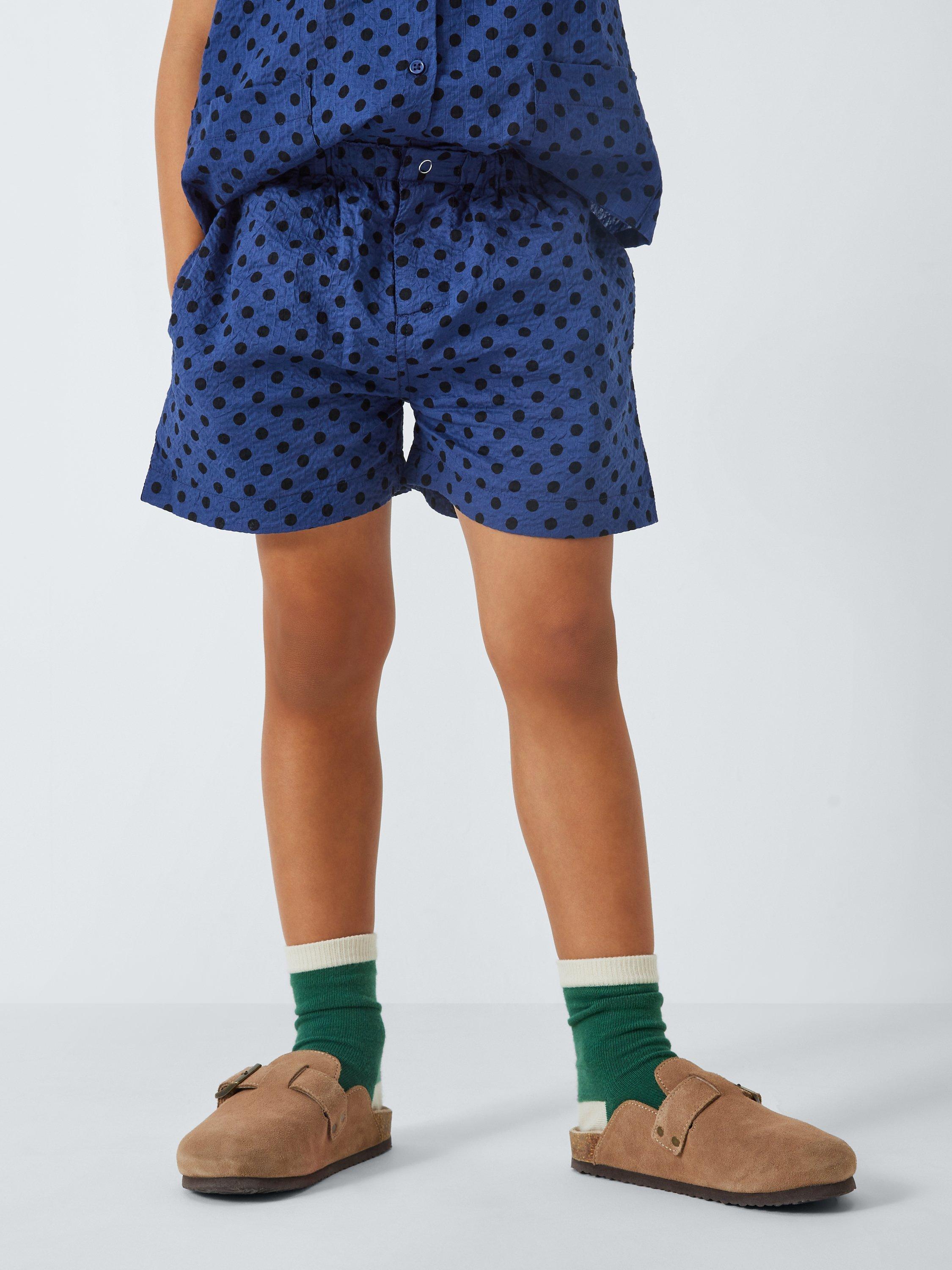 Product image 1 of 7, which shows Caramel Kids' Apium Polka Dot Shorts, Navy, 3 years