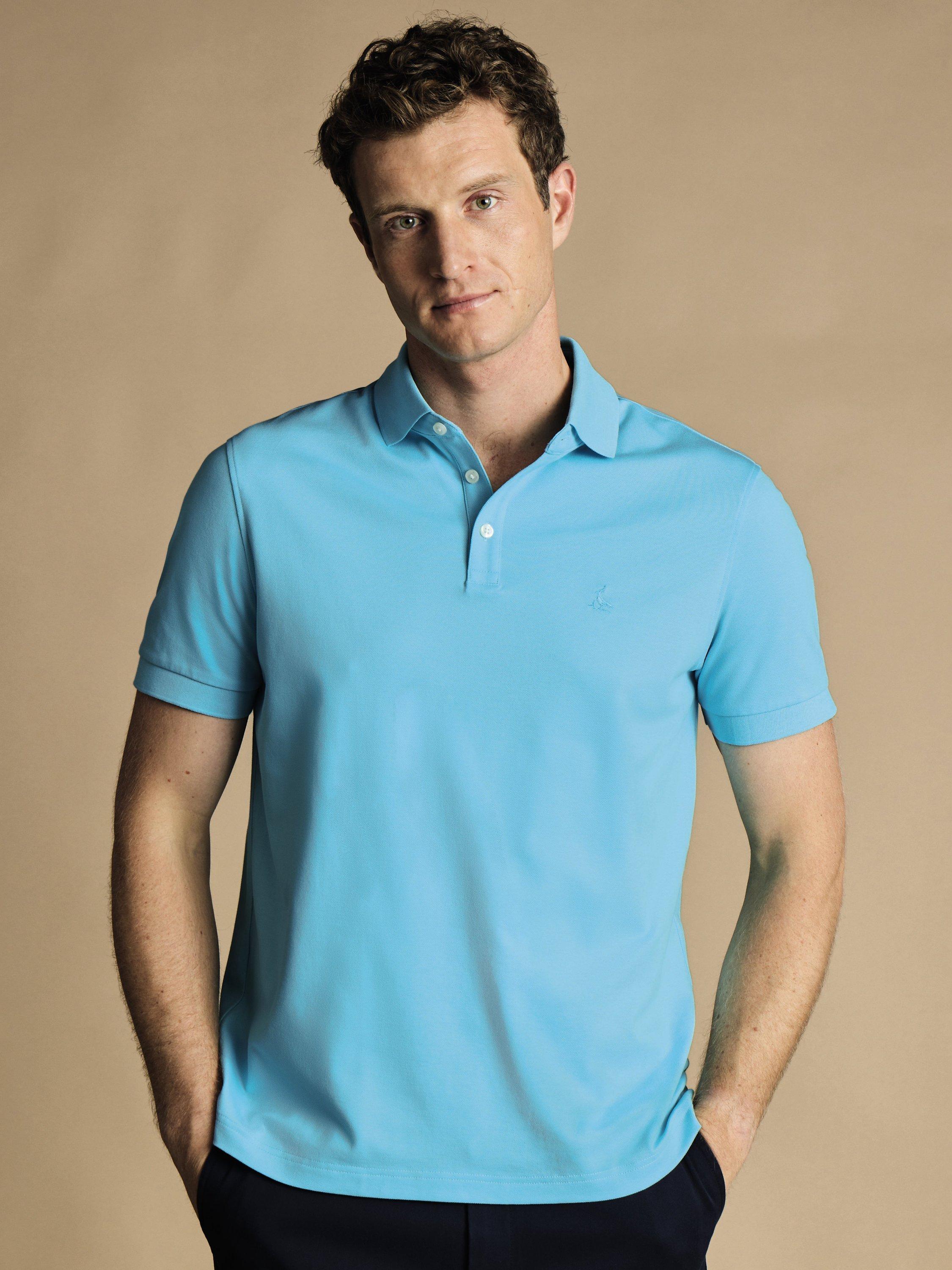Product image 1 of 4, which shows Charles Tyrwhitt Pique Cotton Polo Shirt, Aqua, XS