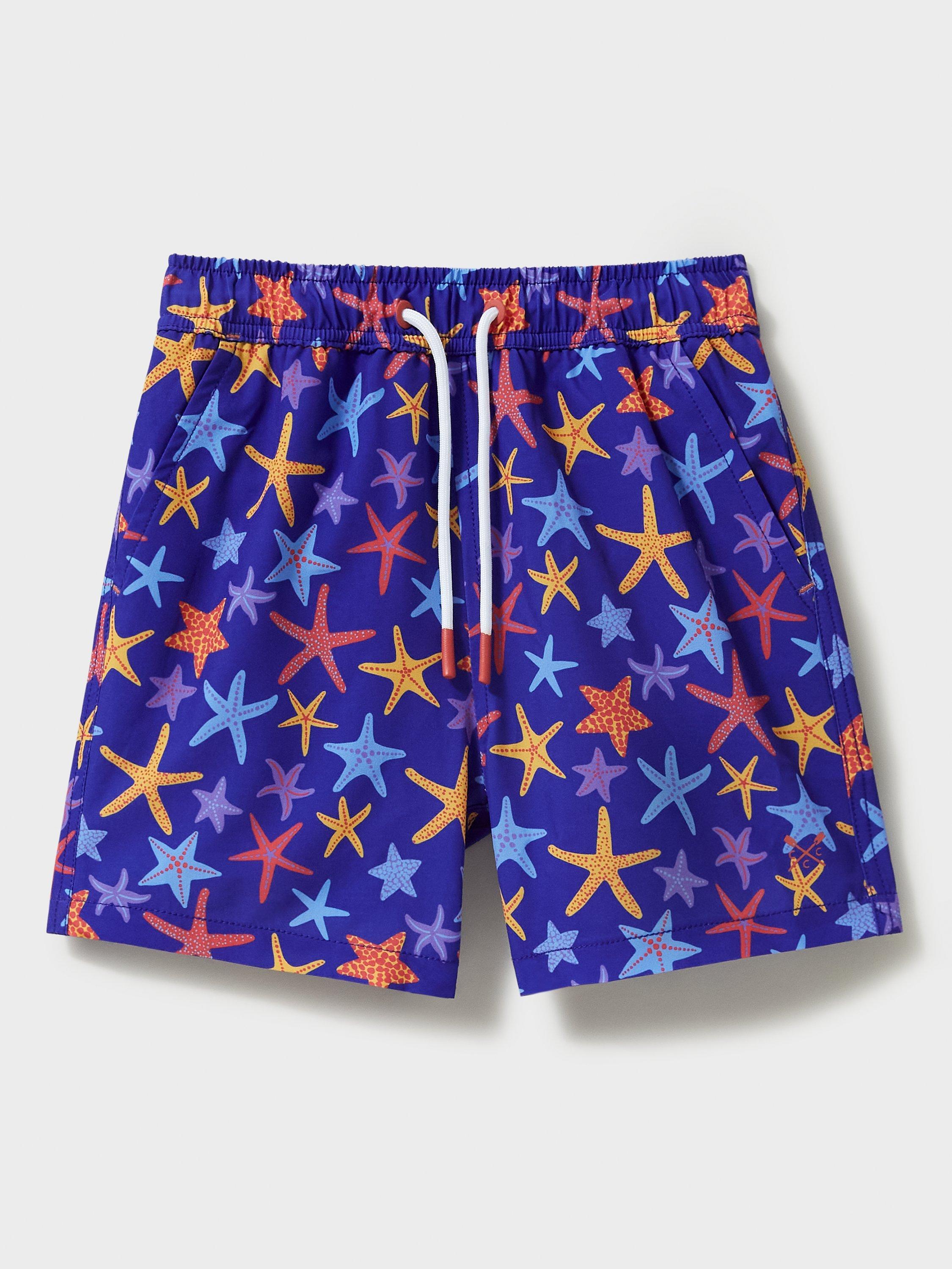 Product image 1 of 3, which shows Crew Clothing Kids' Starfish Print Swim Shorts, Blue/Multi, 8-9 years