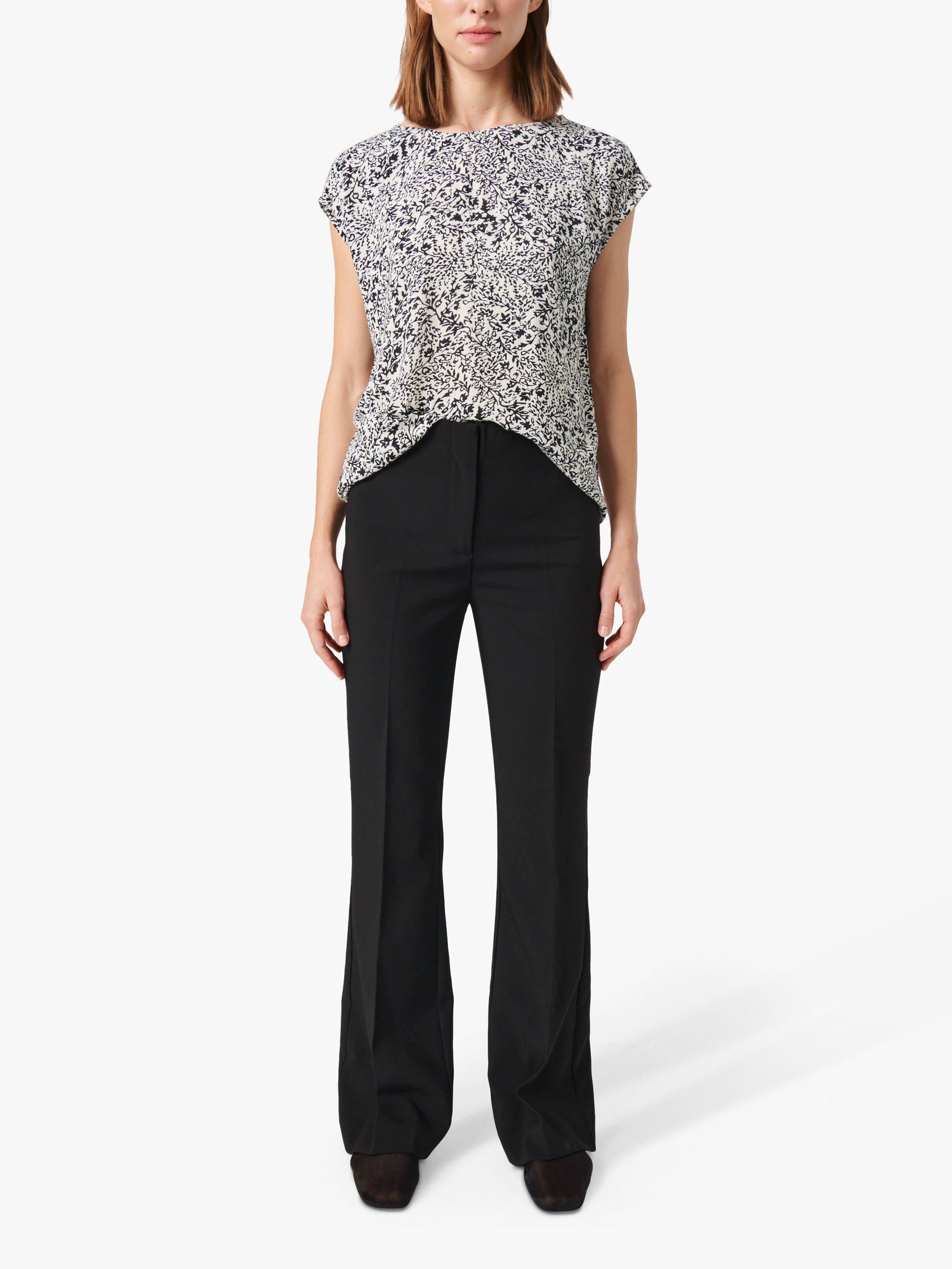 Product image 3 of 6, which shows Soaked In Luxury Zaya Boat Neck Relaxed Fit Top, Black/ White Ditsy, S