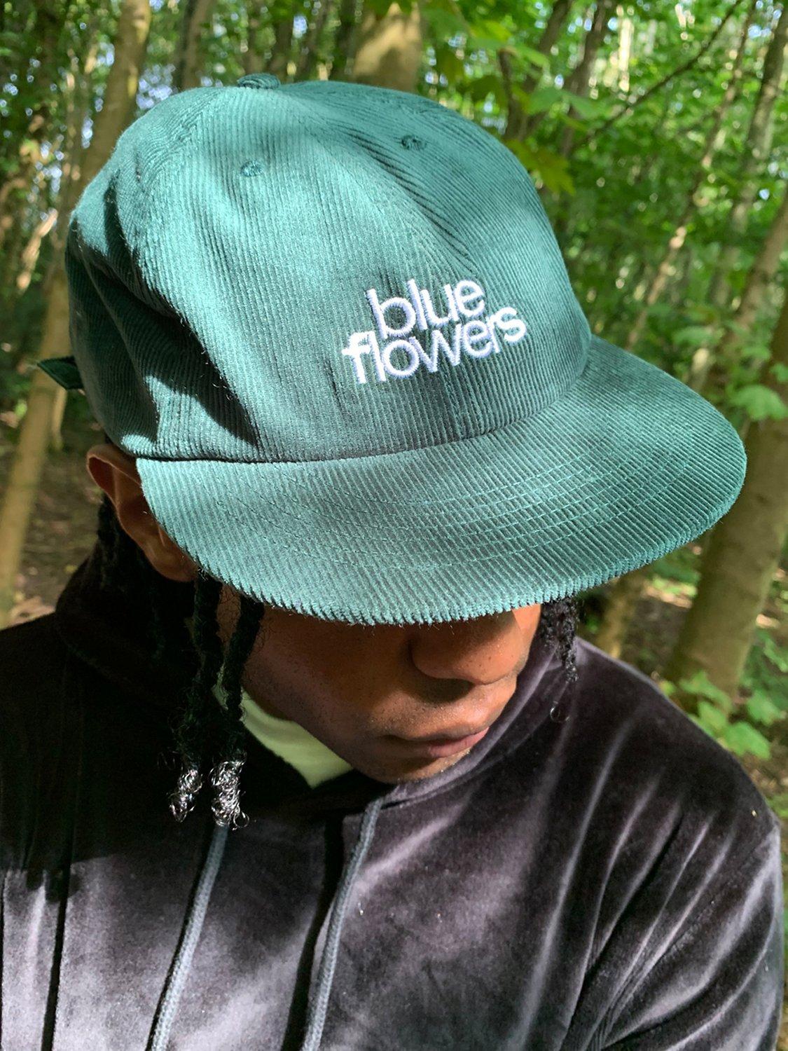 Product image 2 of 4, which shows Blue Flowers Longsight Cap, Green, M