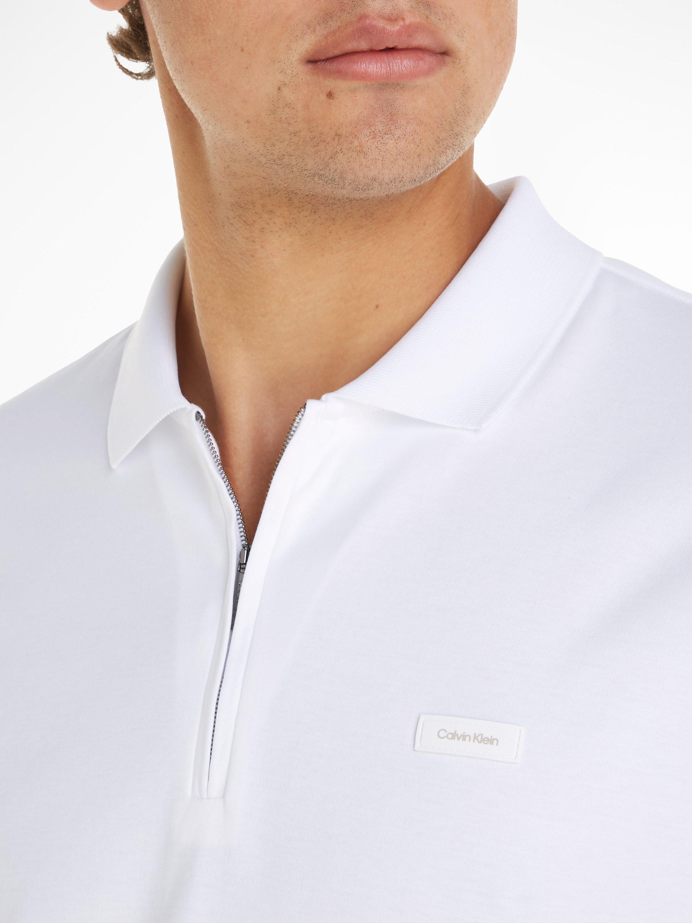 Product image 3 of 5, which shows Calvin Klein Cotton Zip Polo Top, Bright White, XS