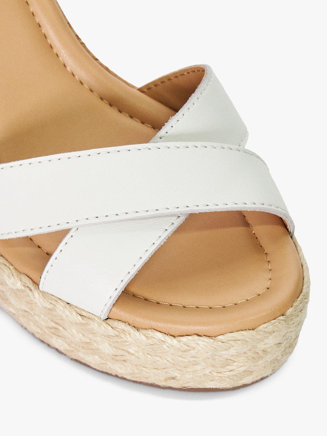 Product image 5 of 6, which shows Dune Kindest Leather Cross Strap Wedge Sandals, White, 3