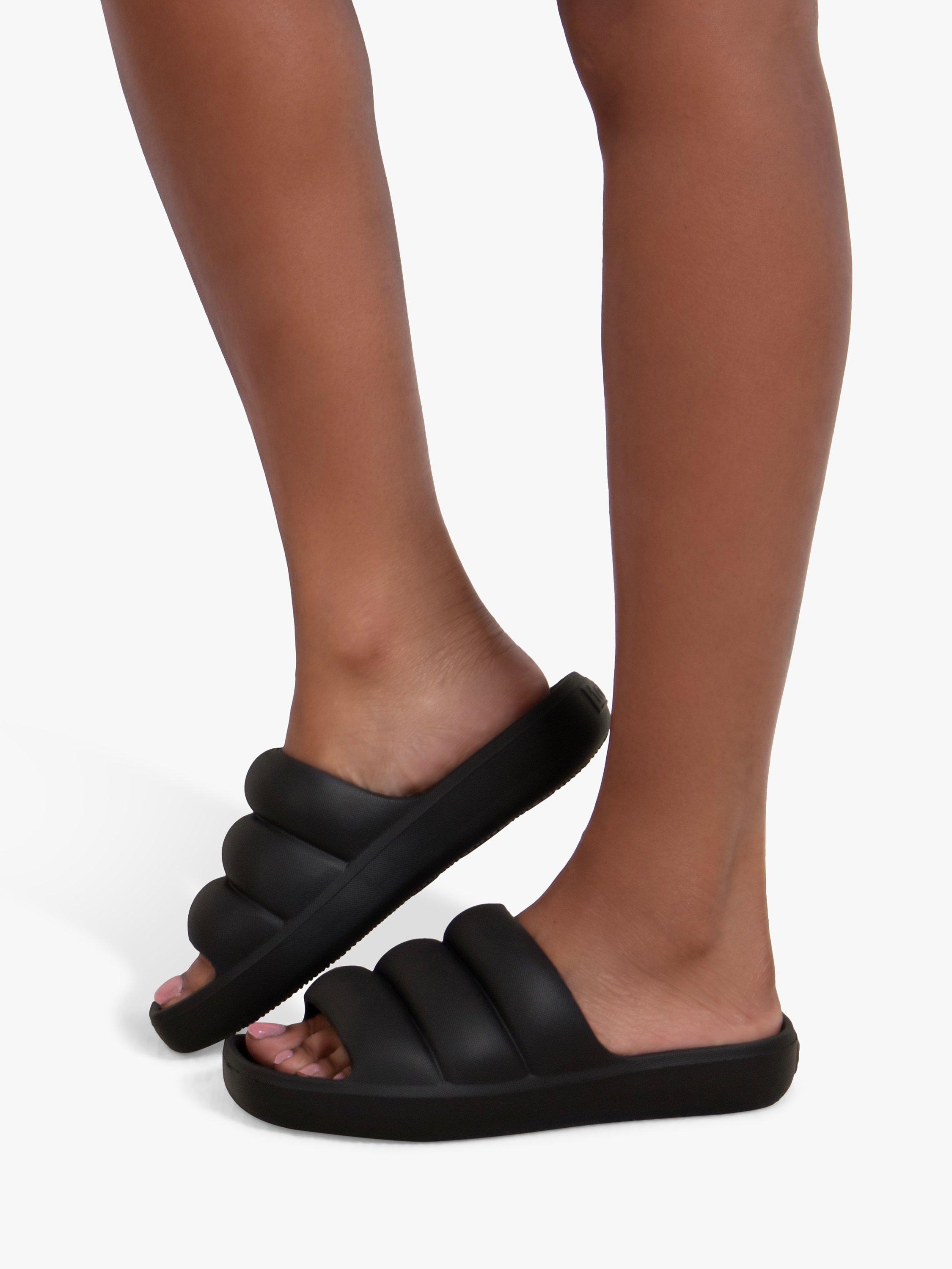 Product image 6 of 6, which shows totes Puffy Slider Sandals, Black, 4