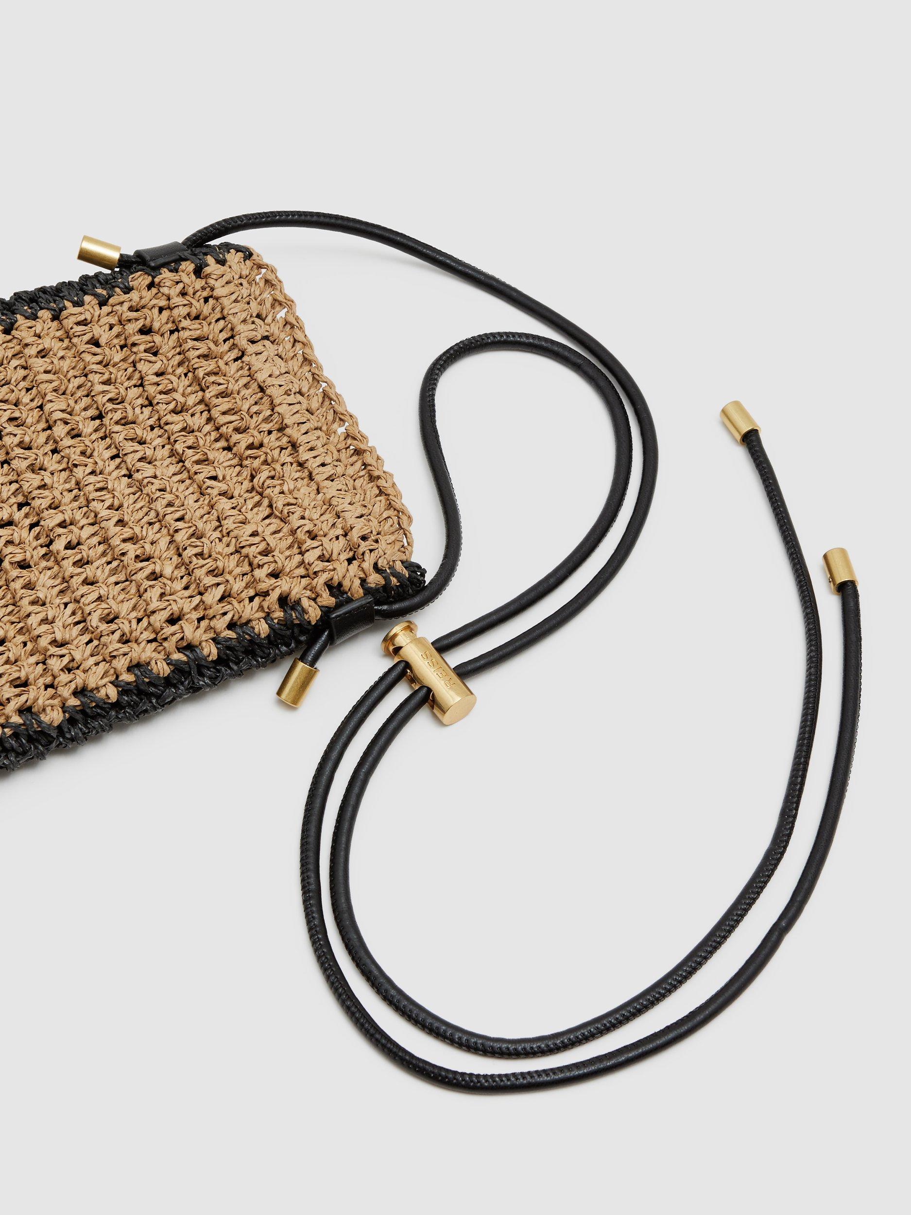Product image 2 of 5, which shows Reiss Taylor Raffia Phone Cross Body Bag, Natural, One Size