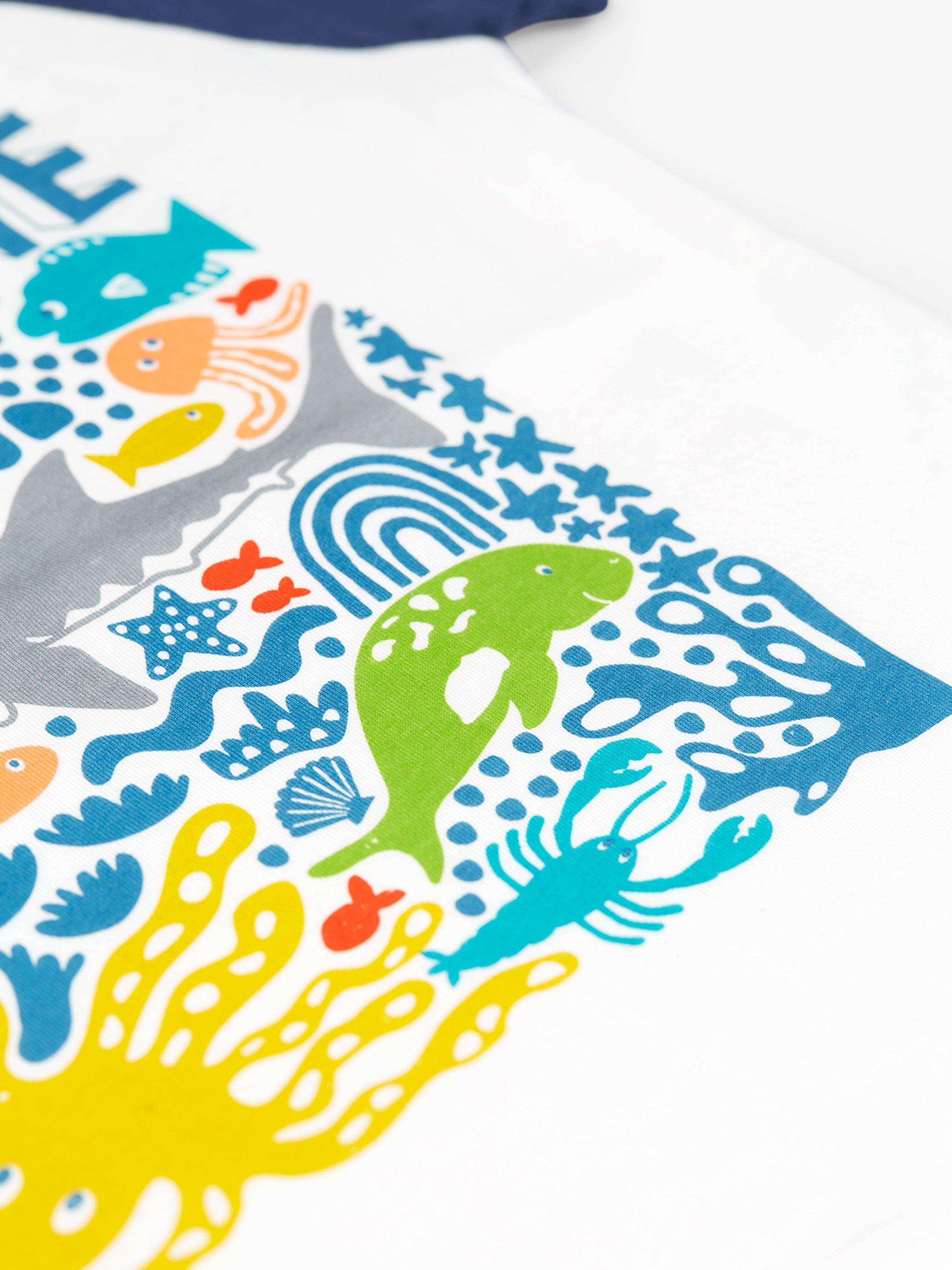 Product image 4 of 4, which shows Frugi Kids' Reid Jawsome Organic Cotton Raglan T-shirt, Soft White/Multi, 7-8 years