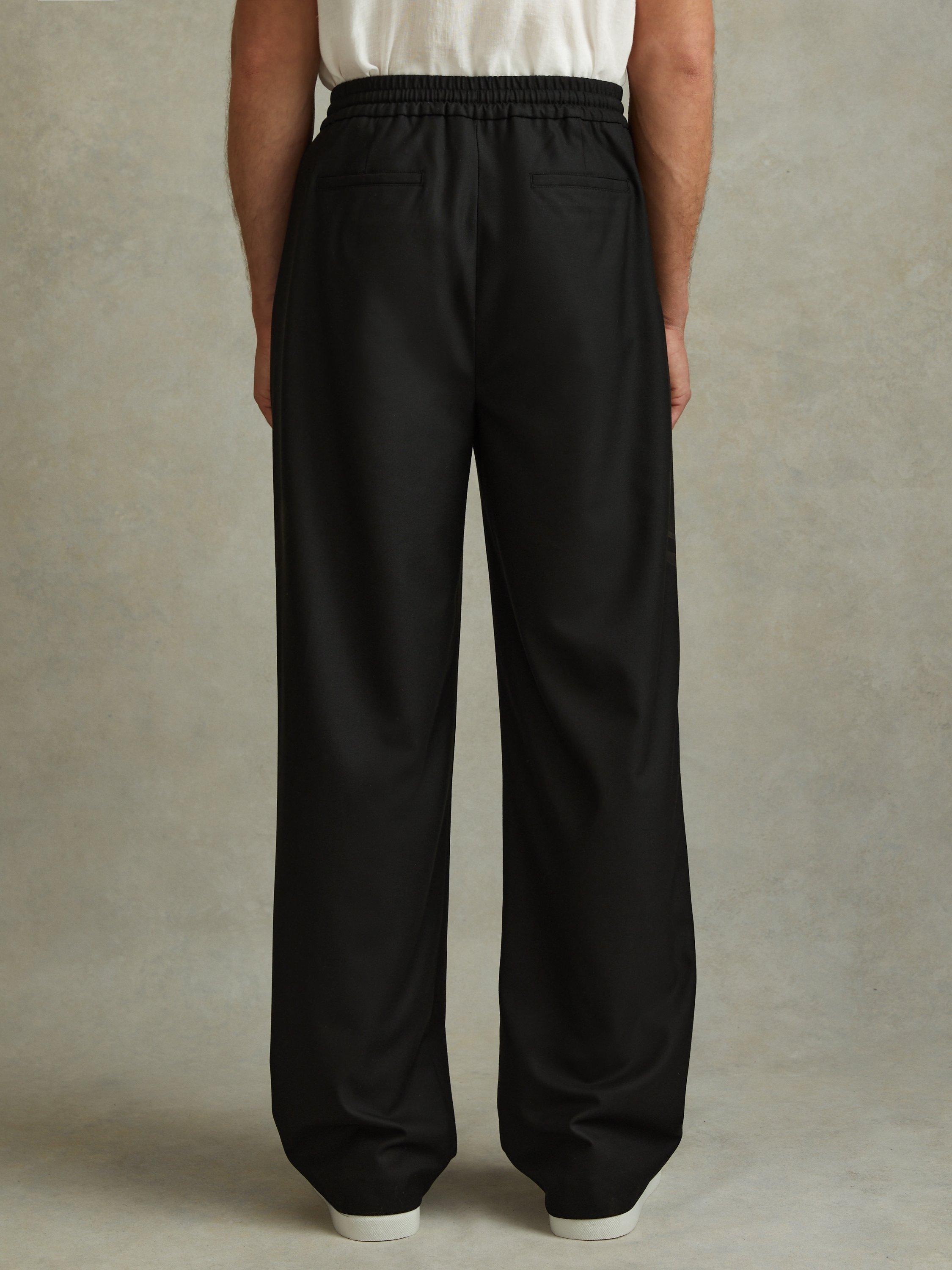 Product image 2 of 5, which shows Reiss Arden Relaxed Twill Drawstring Trousers, Black, 28R