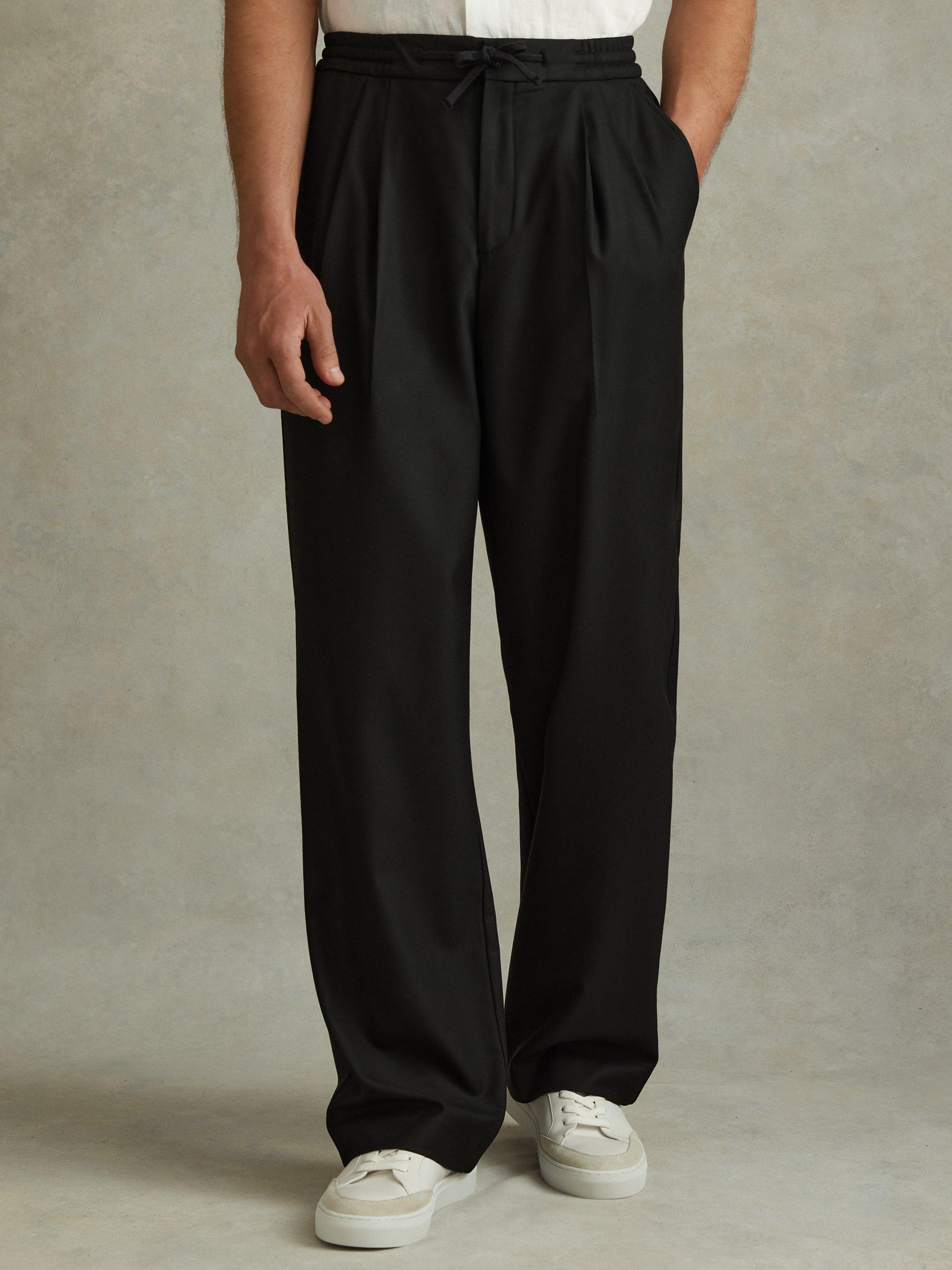 Product image 1 of 5, which shows Reiss Arden Relaxed Twill Drawstring Trousers, Black, 28R