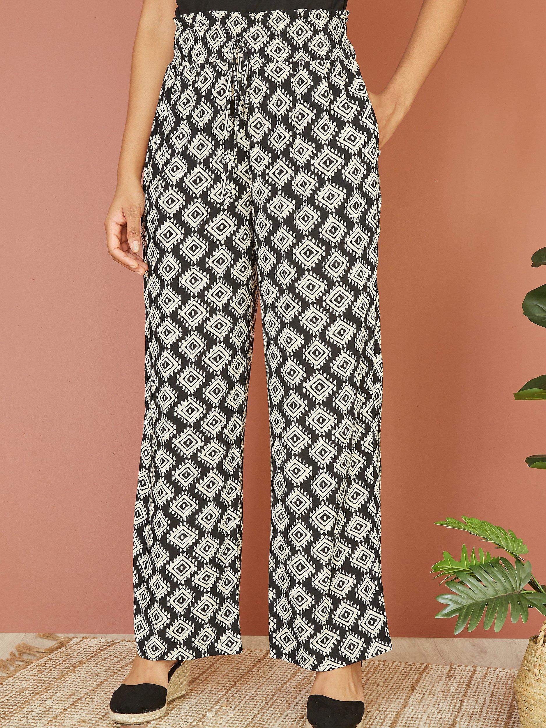 Product image 1 of 4, which shows Yumi Geometric Print Relaxed Fit Trousers, Black, 8