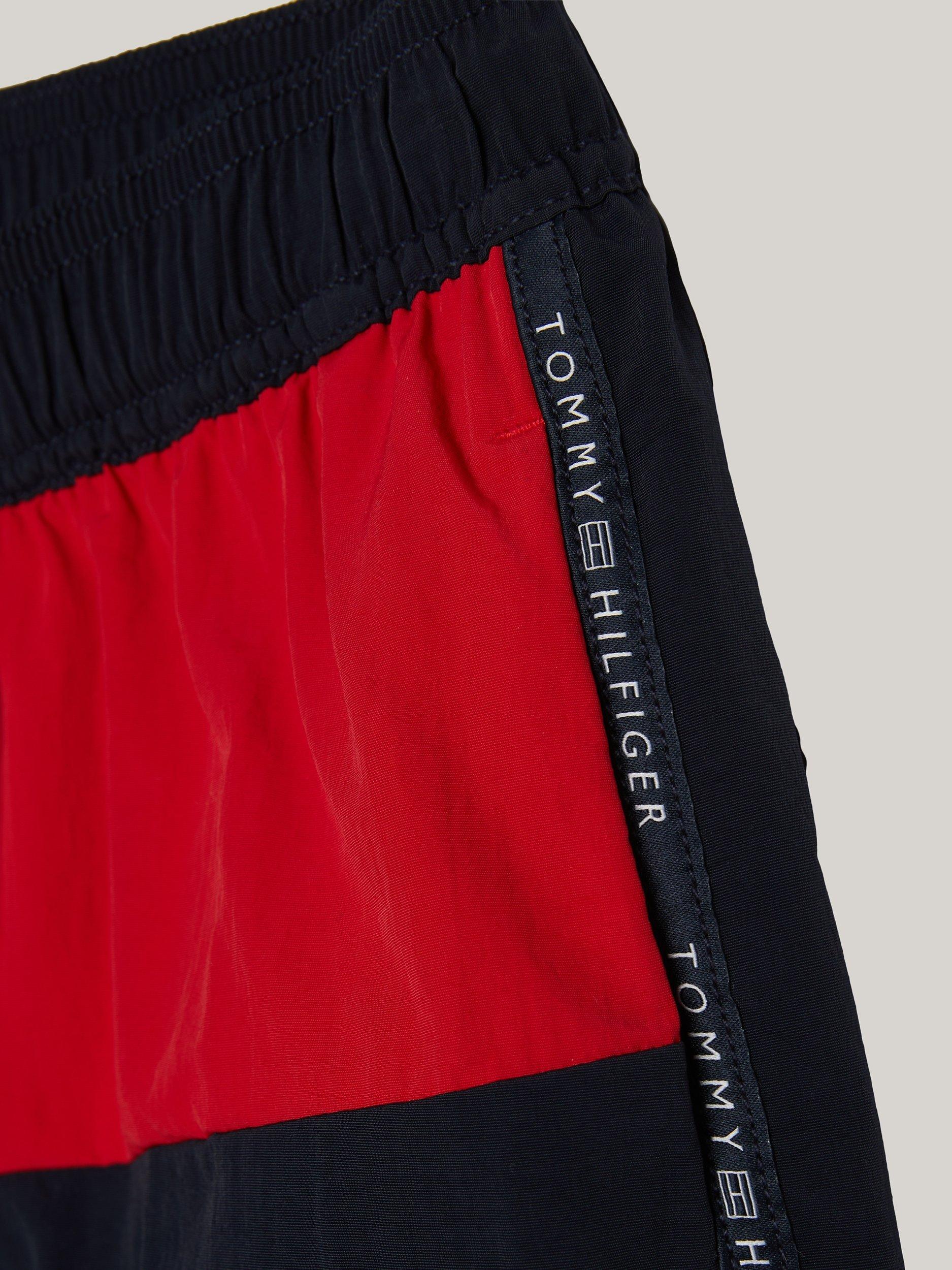 Product image 3 of 3, which shows Tommy Hilfiger Kids' Logo Flag Medium Drawstring Swim Shorts, Desert Sky, 10-12 years