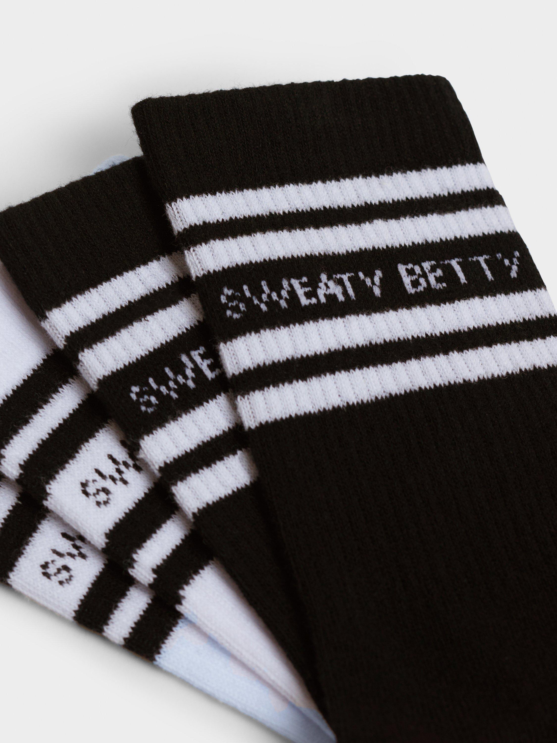 Product image 2 of 4, which shows Sweaty Betty Varsity Gripper Ankle Socks, Pack of 2, White/Black, 2.5-5